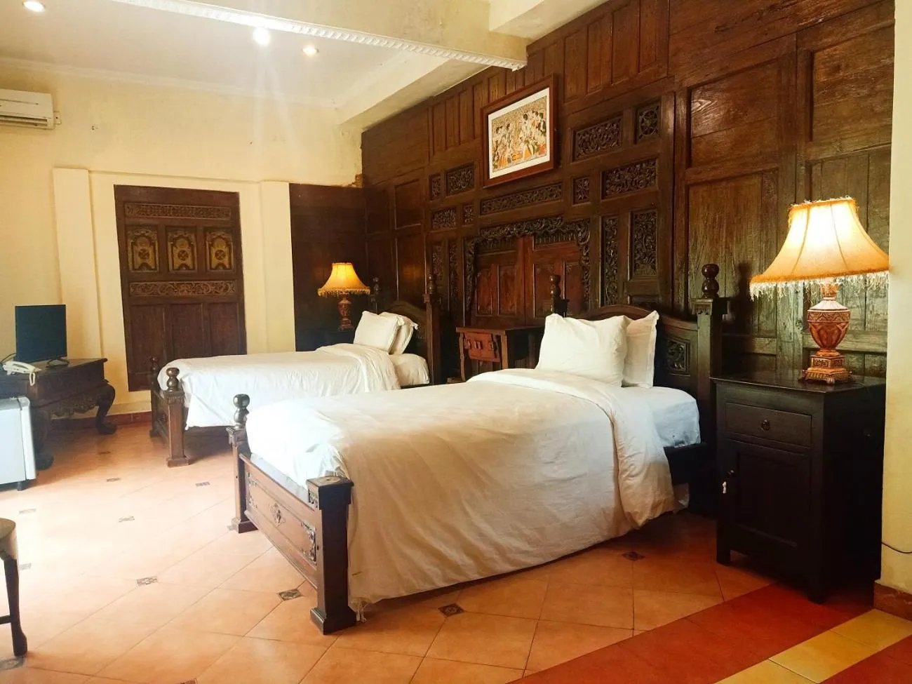 Bed in Joglo Plawang Villa & Resort