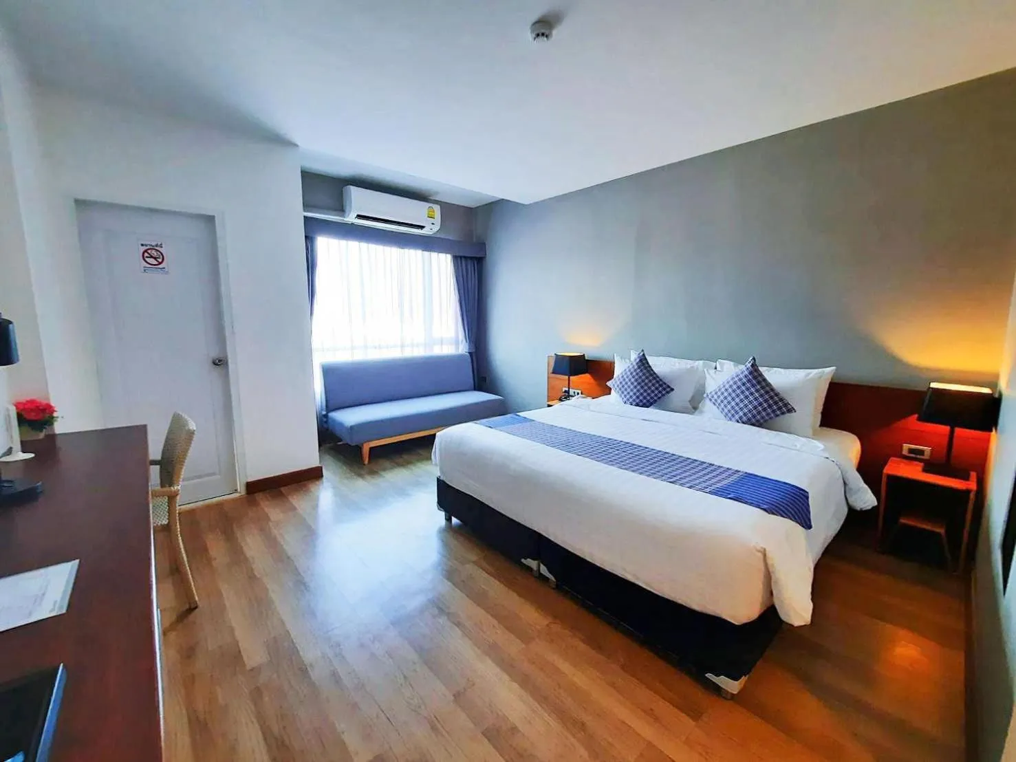 Photo of the whole room, Bed in Comet Hotel Surat Thani