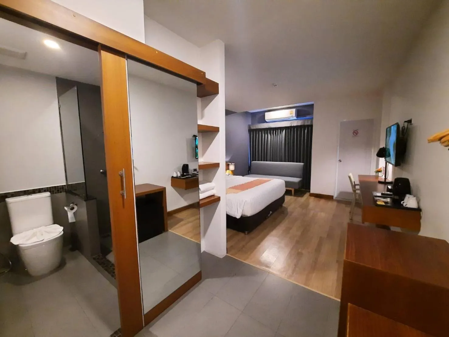 Photo of the whole room, Bed in Comet Hotel Surat Thani