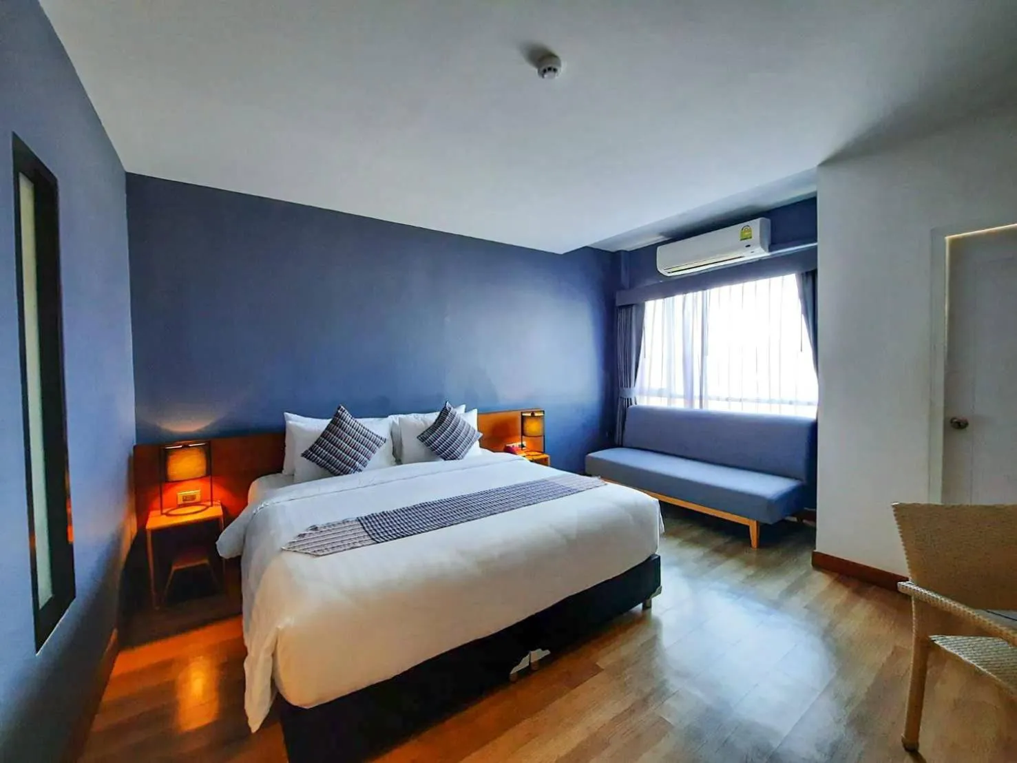 Photo of the whole room, Bed in Comet Hotel Surat Thani