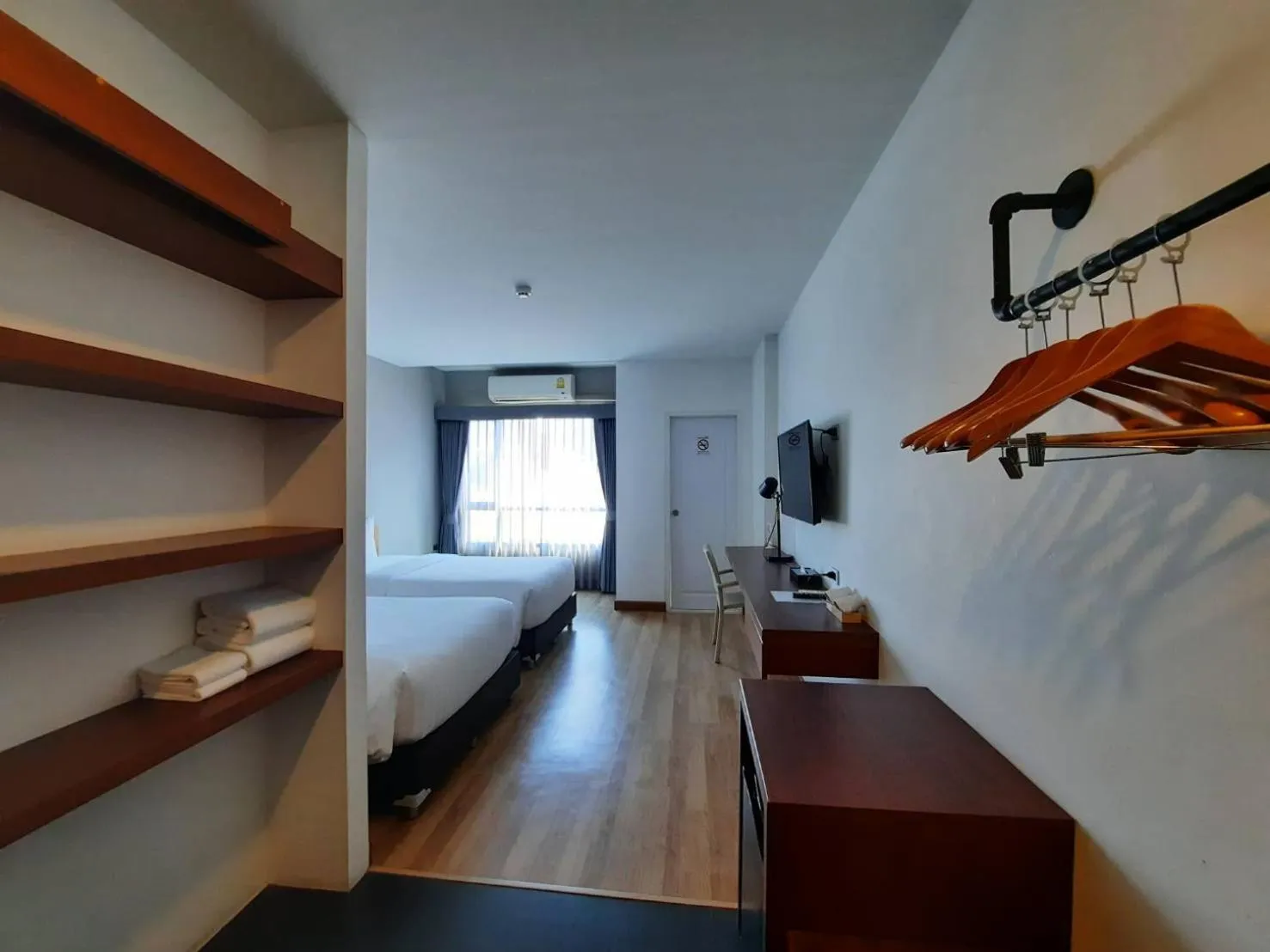 Photo of the whole room, Bed in Comet Hotel Surat Thani