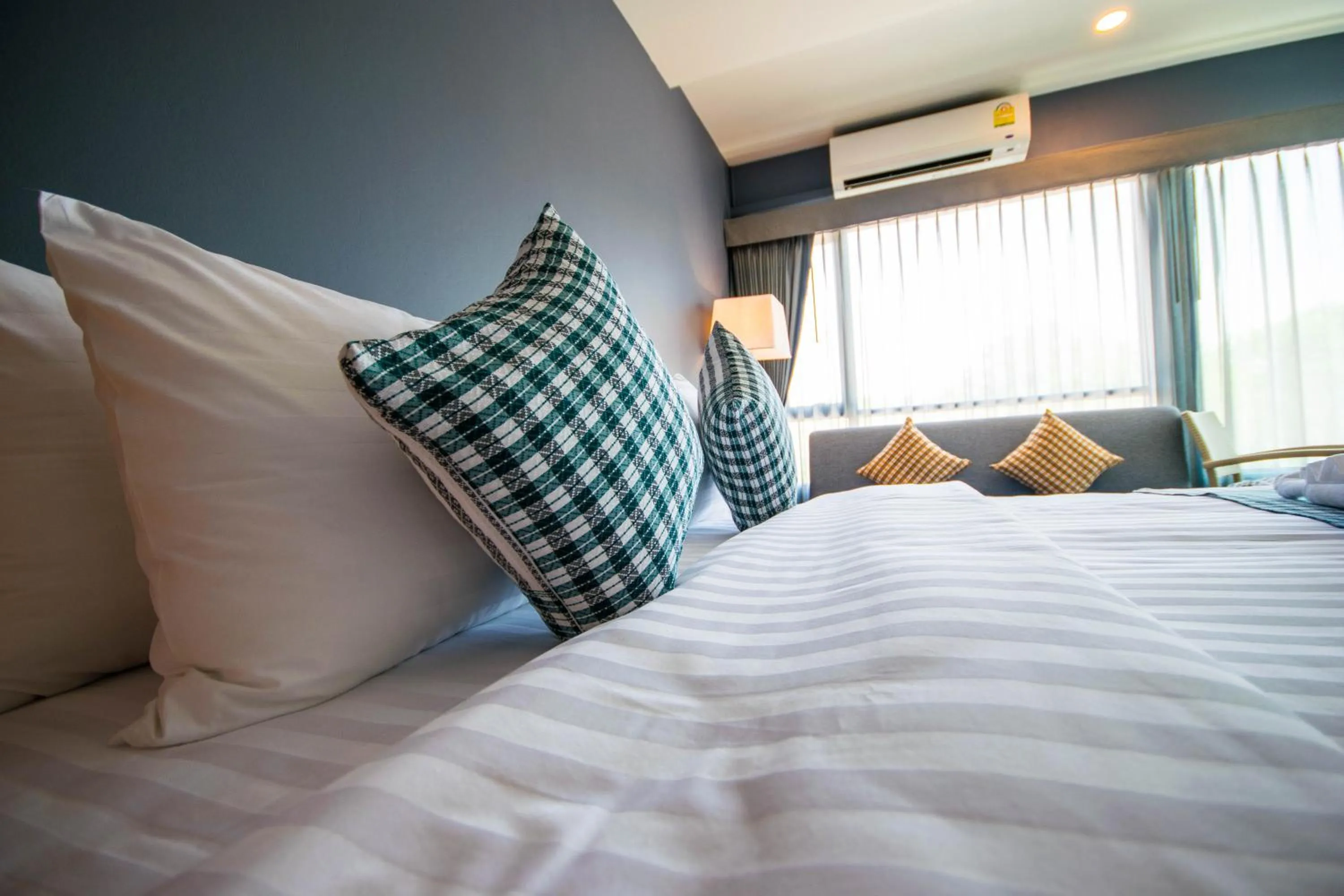 Photo of the whole room, Bed in Comet Hotel Surat Thani