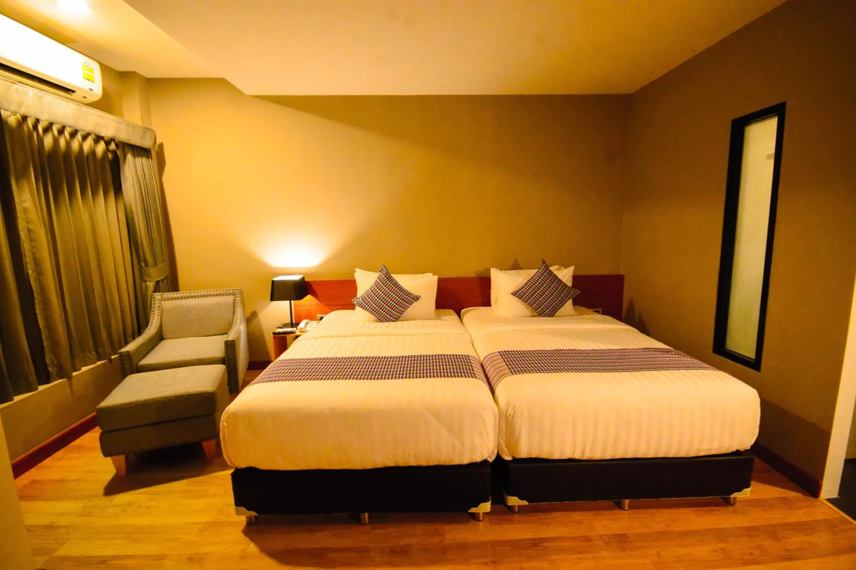 Photo of the whole room, Bed in Comet Hotel Surat Thani