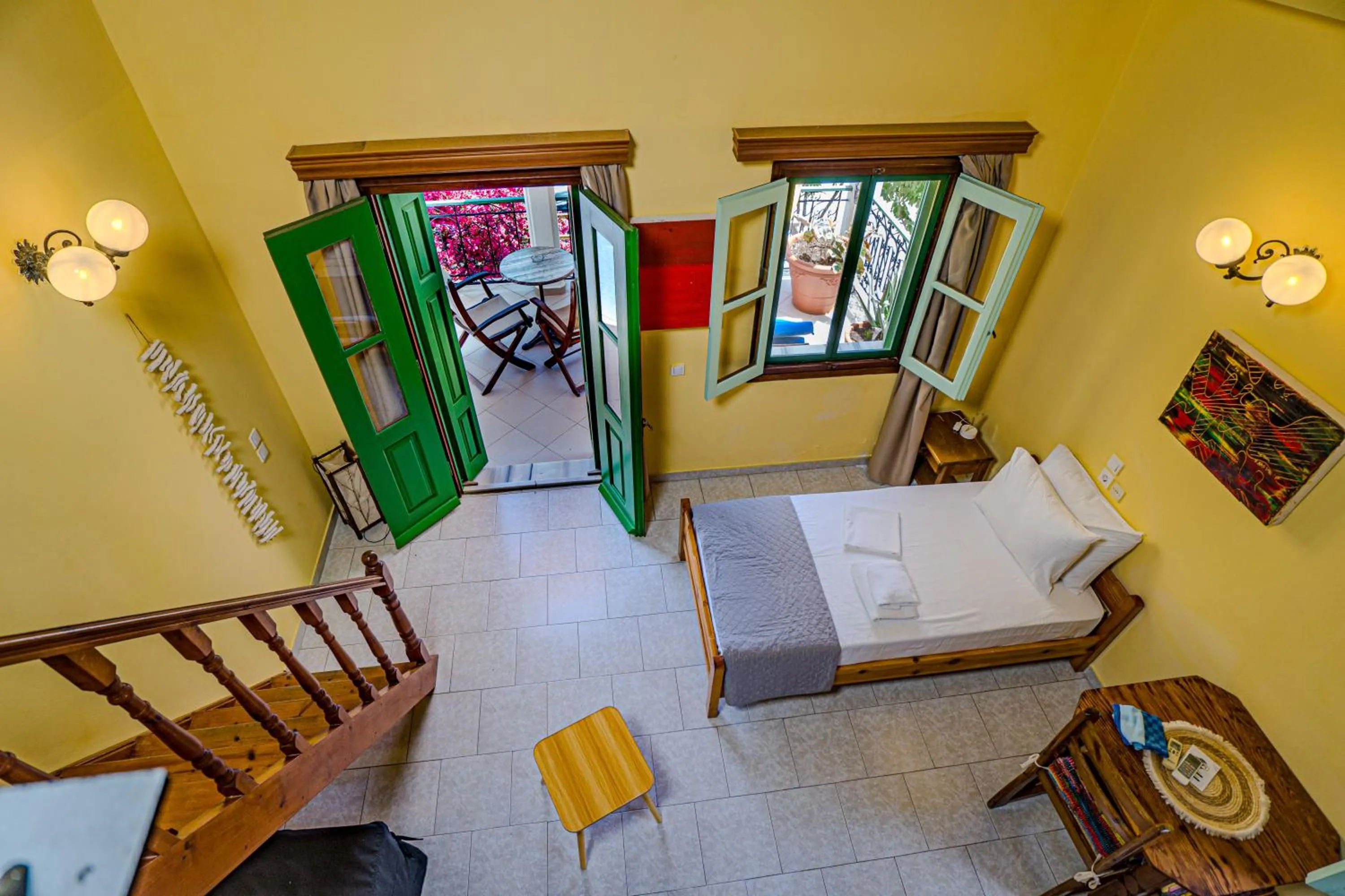 Seating area, Bed in Symi Garden Studios