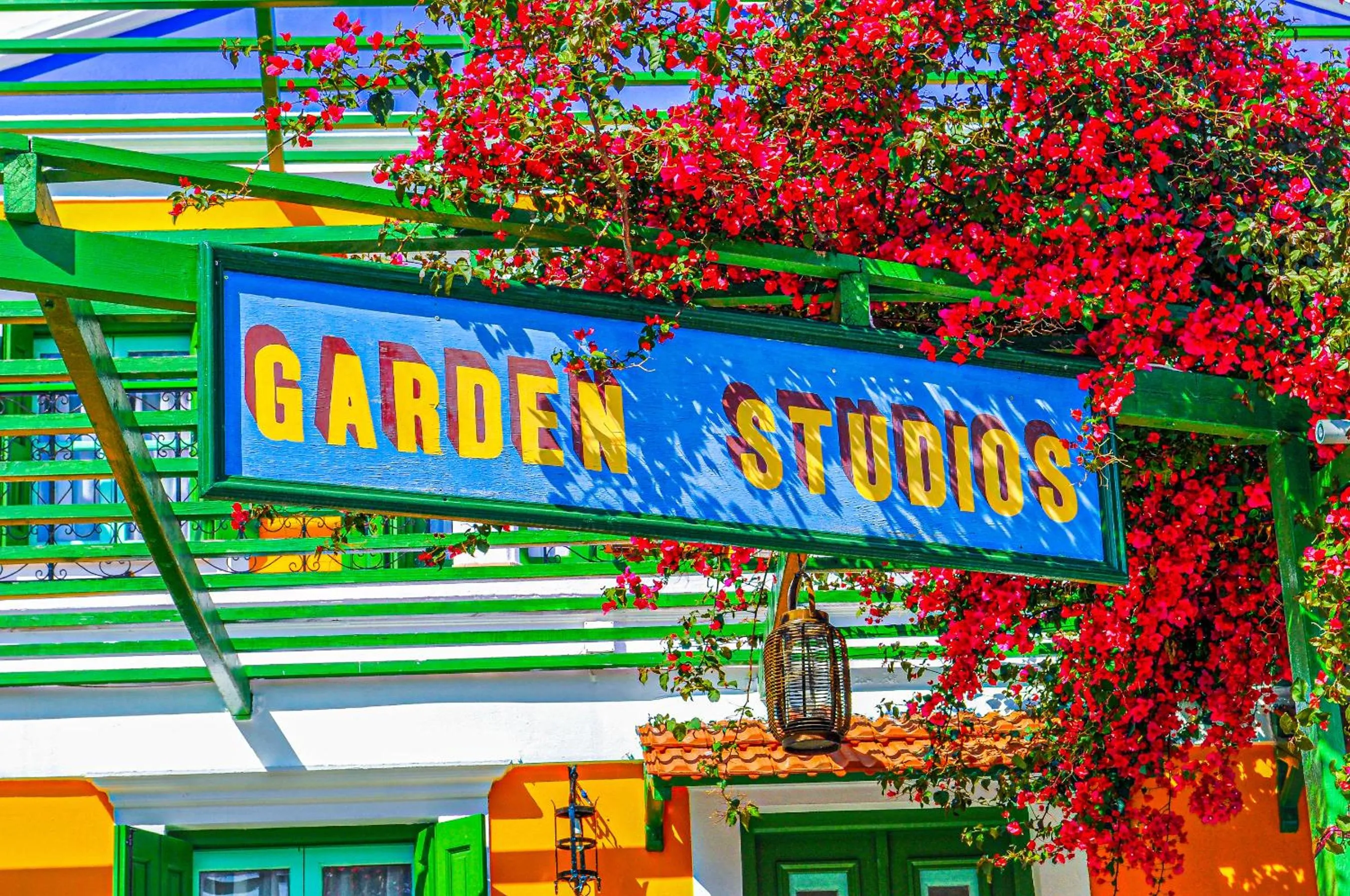 Property logo or sign in Symi Garden Studios