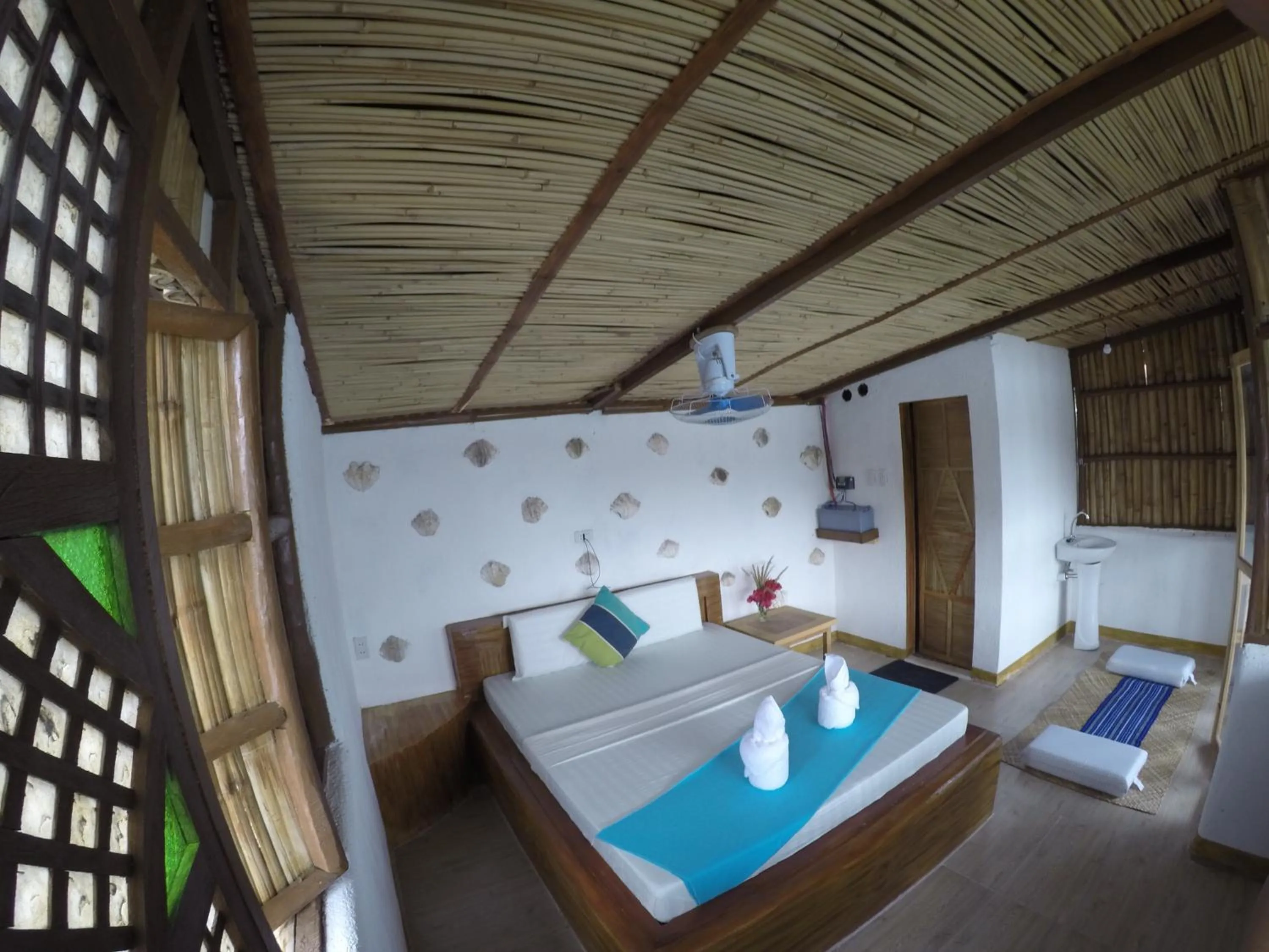 Bed in Borac Bay Bungalows Hotel and Resort
