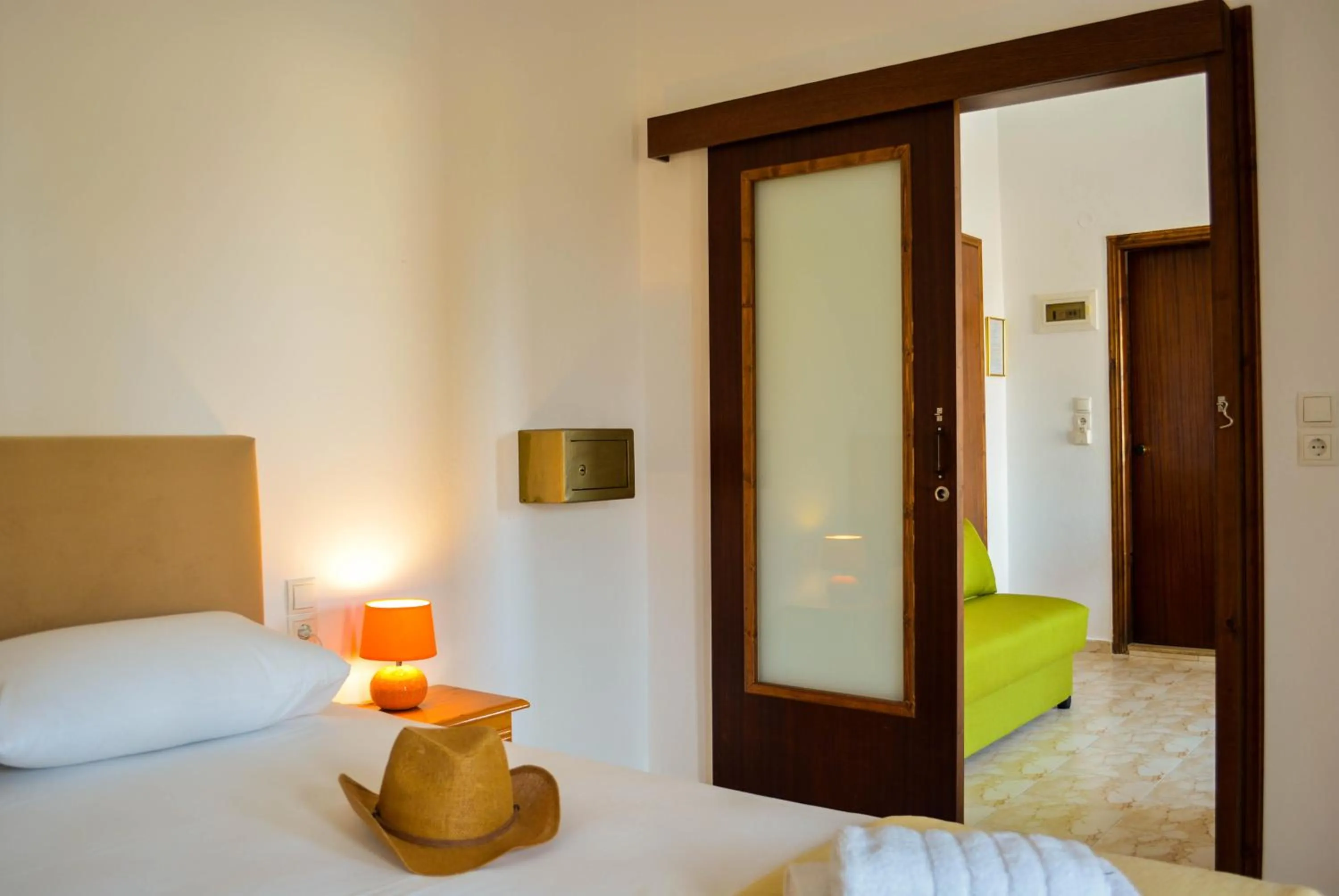 Seating area, Bed in Arhodiko Hotel