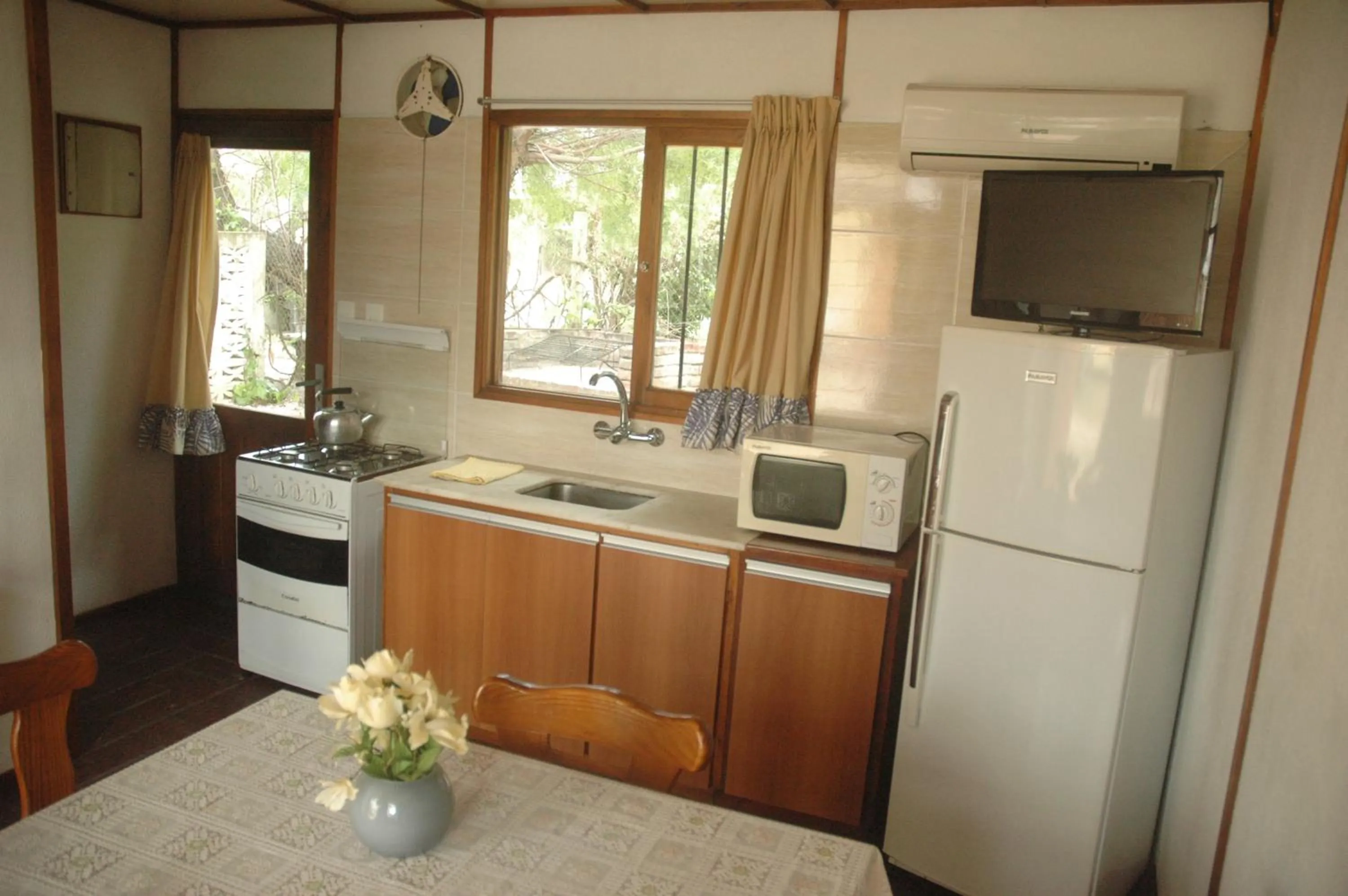 Kitchen or kitchenette in Paradise Complejo Turístico