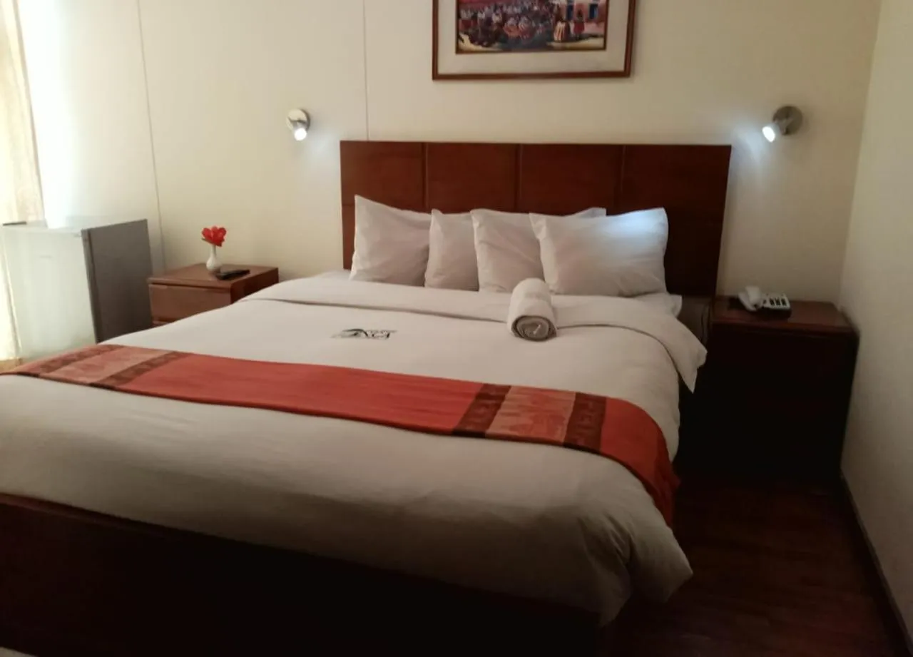 Bed in Golden Inca Hotel