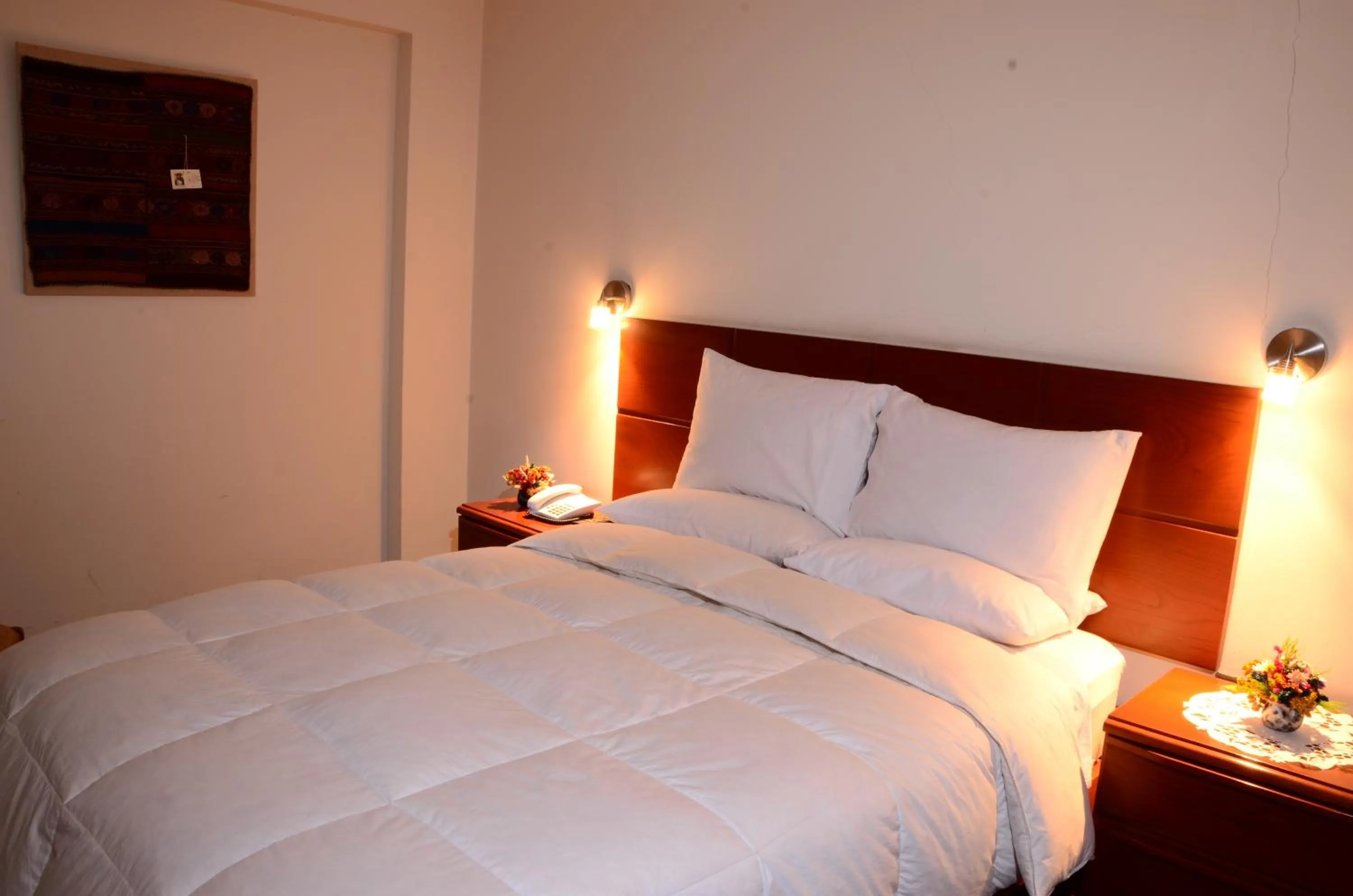 Bed in Golden Inca Hotel