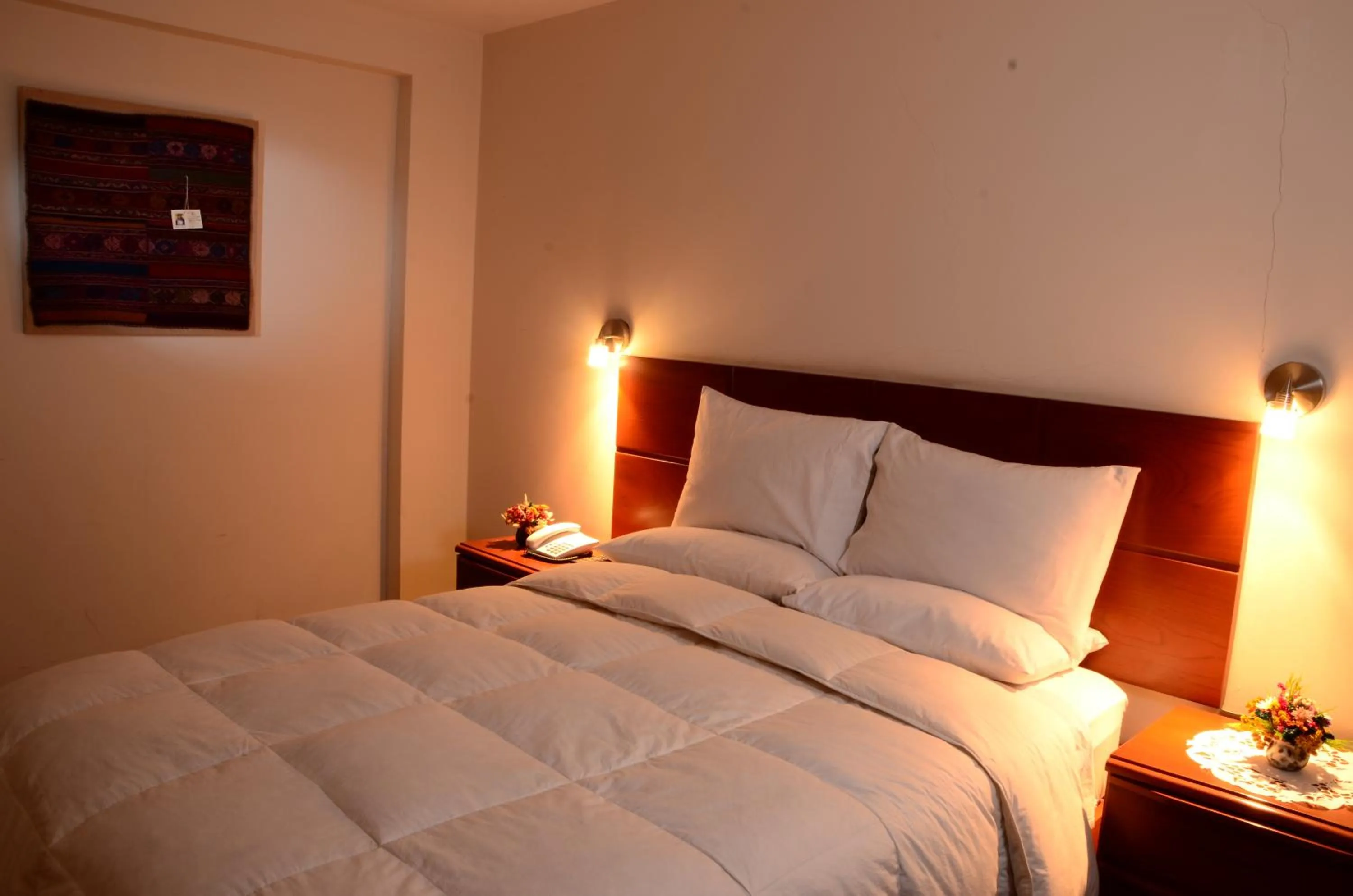 Bed in Golden Inca Hotel