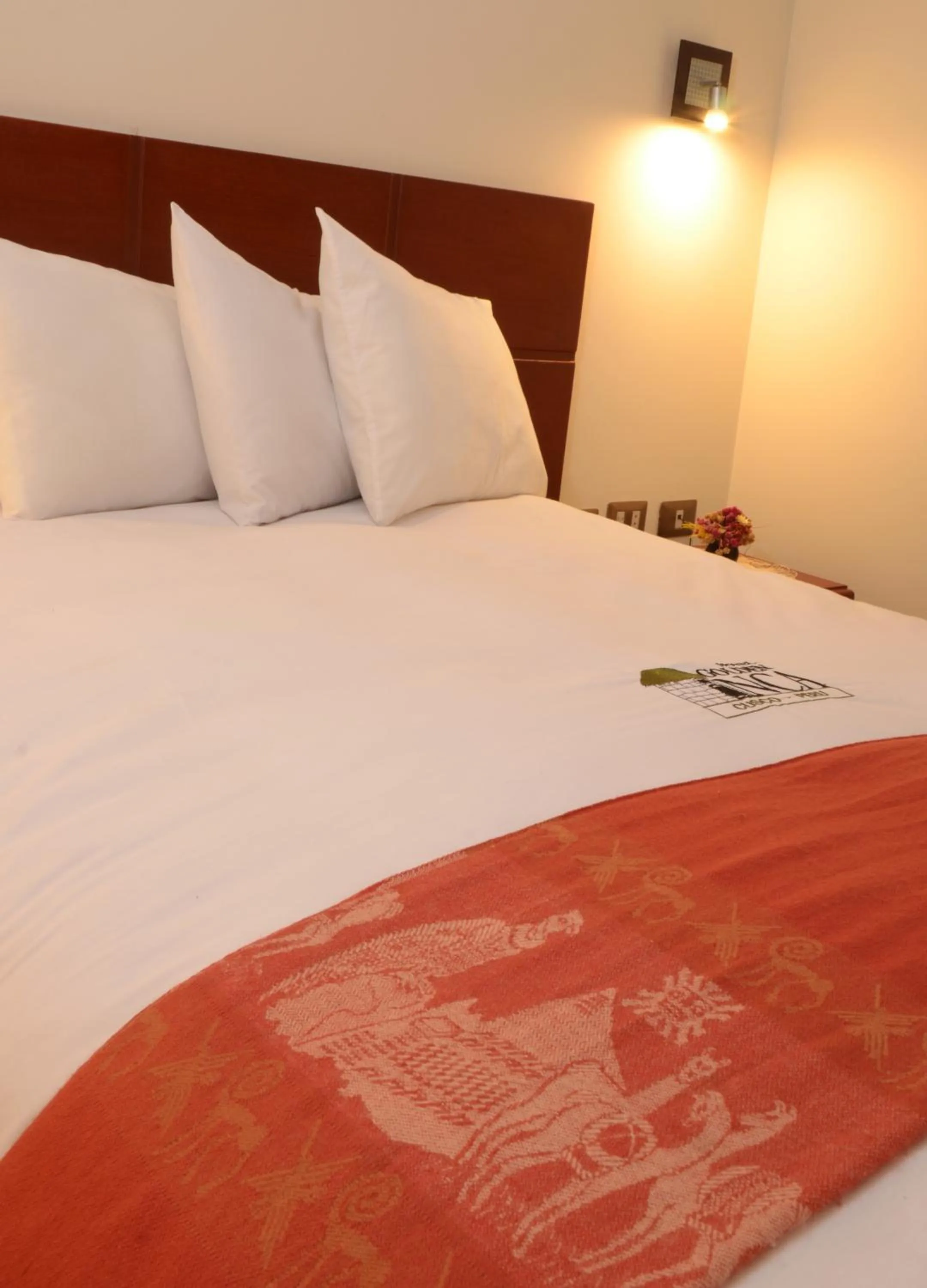 Bed in Golden Inca Hotel