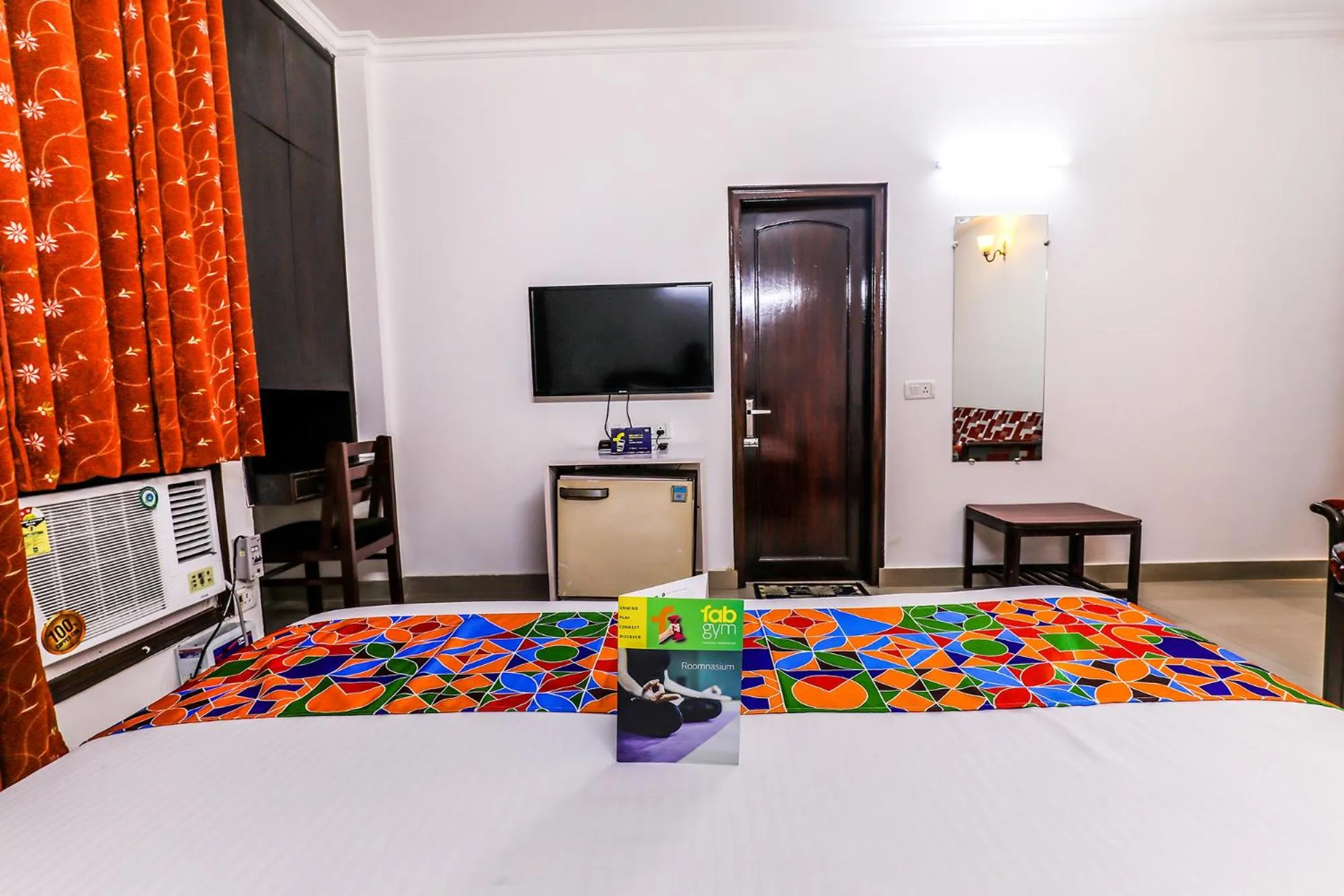 Seating area, Bed in FabExpress Hemkunt Mansion