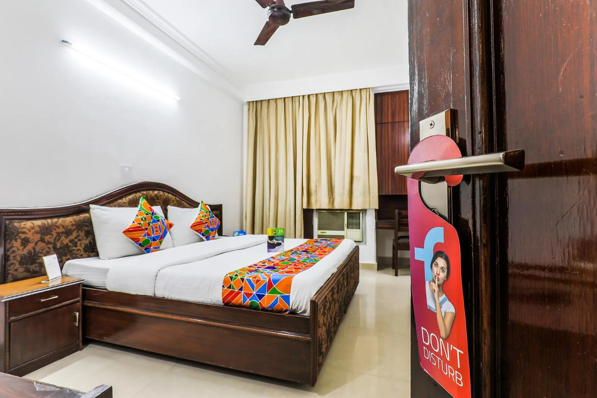 Seating area, Bed in FabExpress Hemkunt Mansion