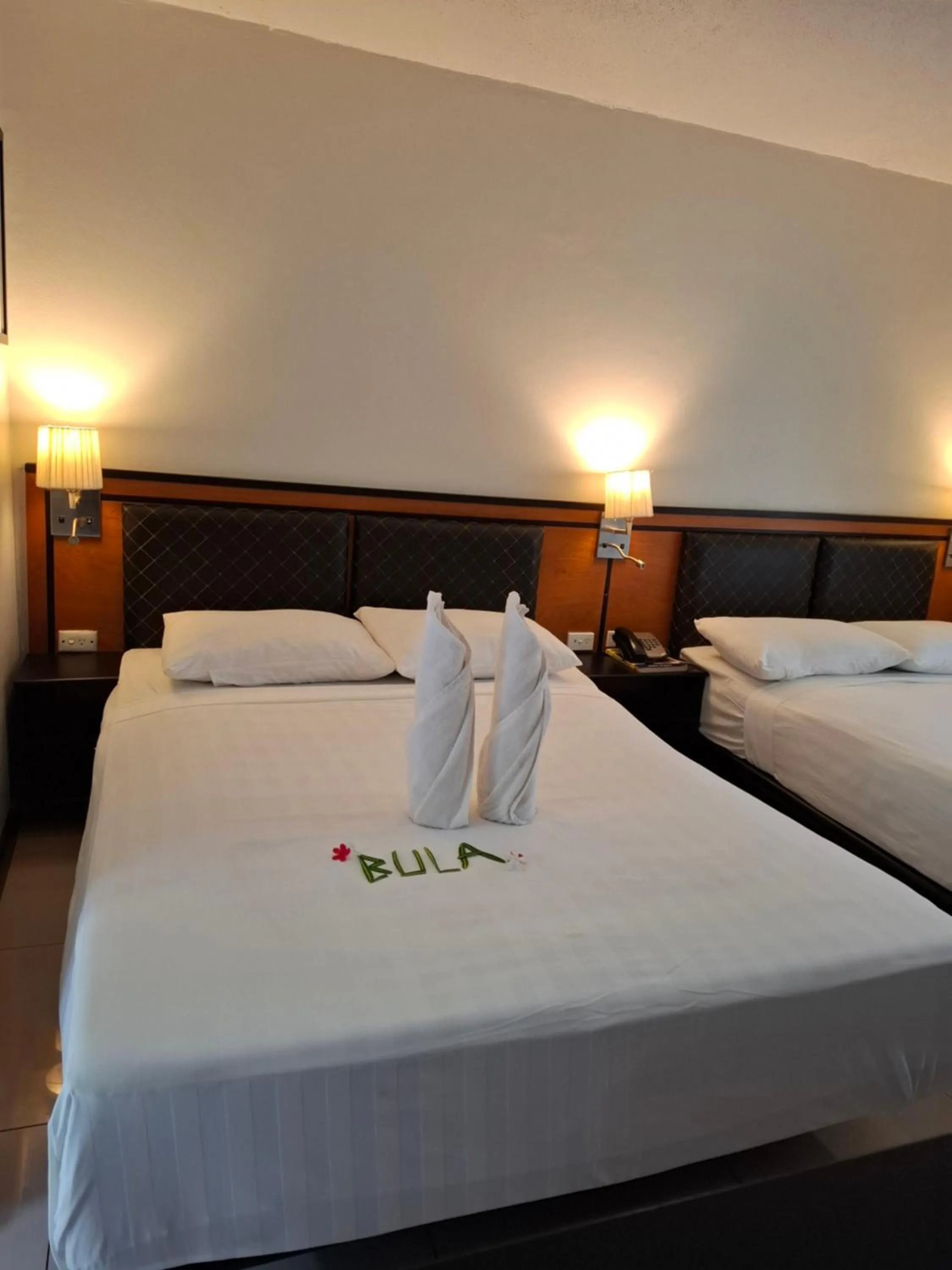 Bed in Capricorn International Hotel