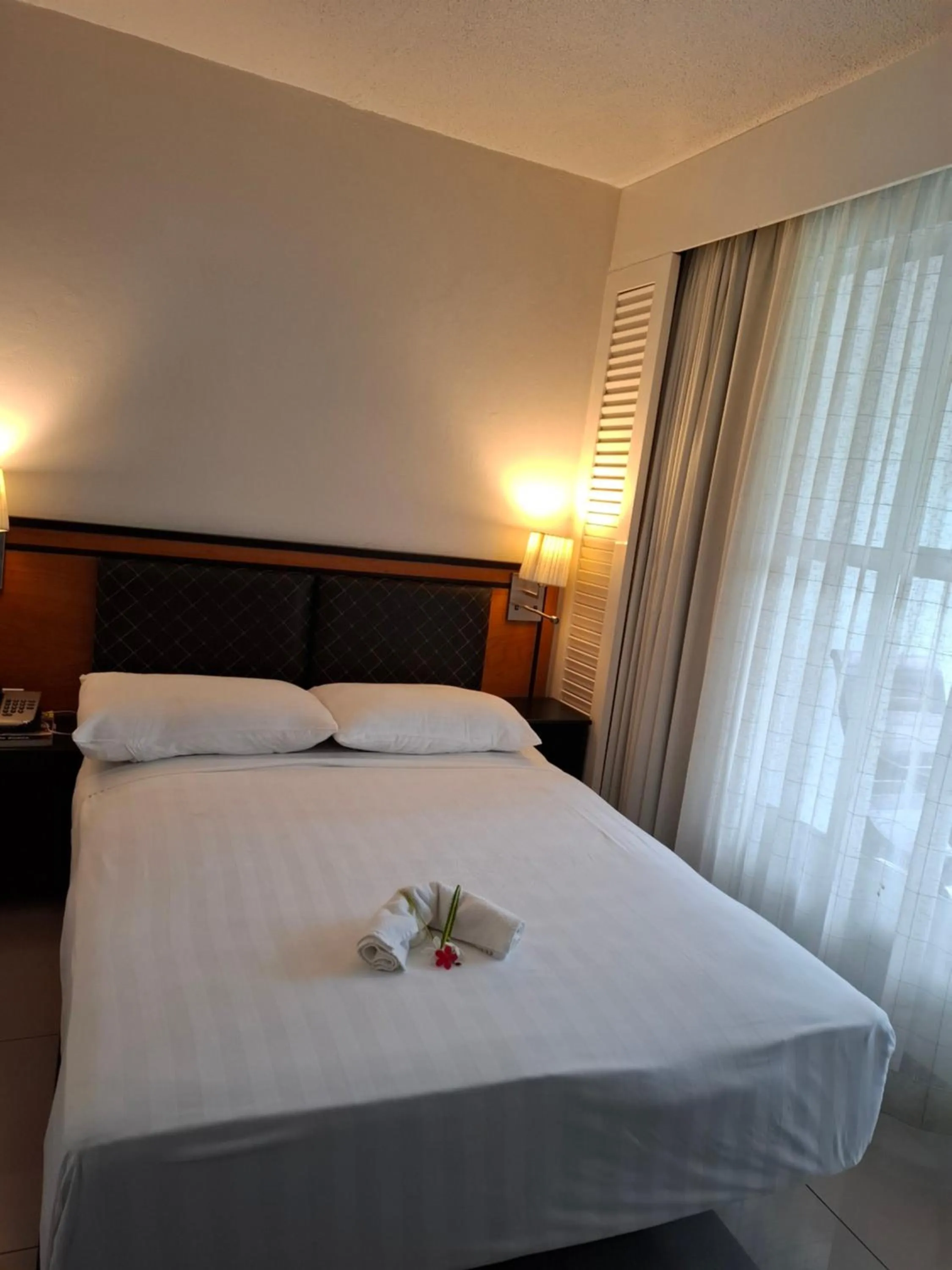 Bed in Capricorn International Hotel