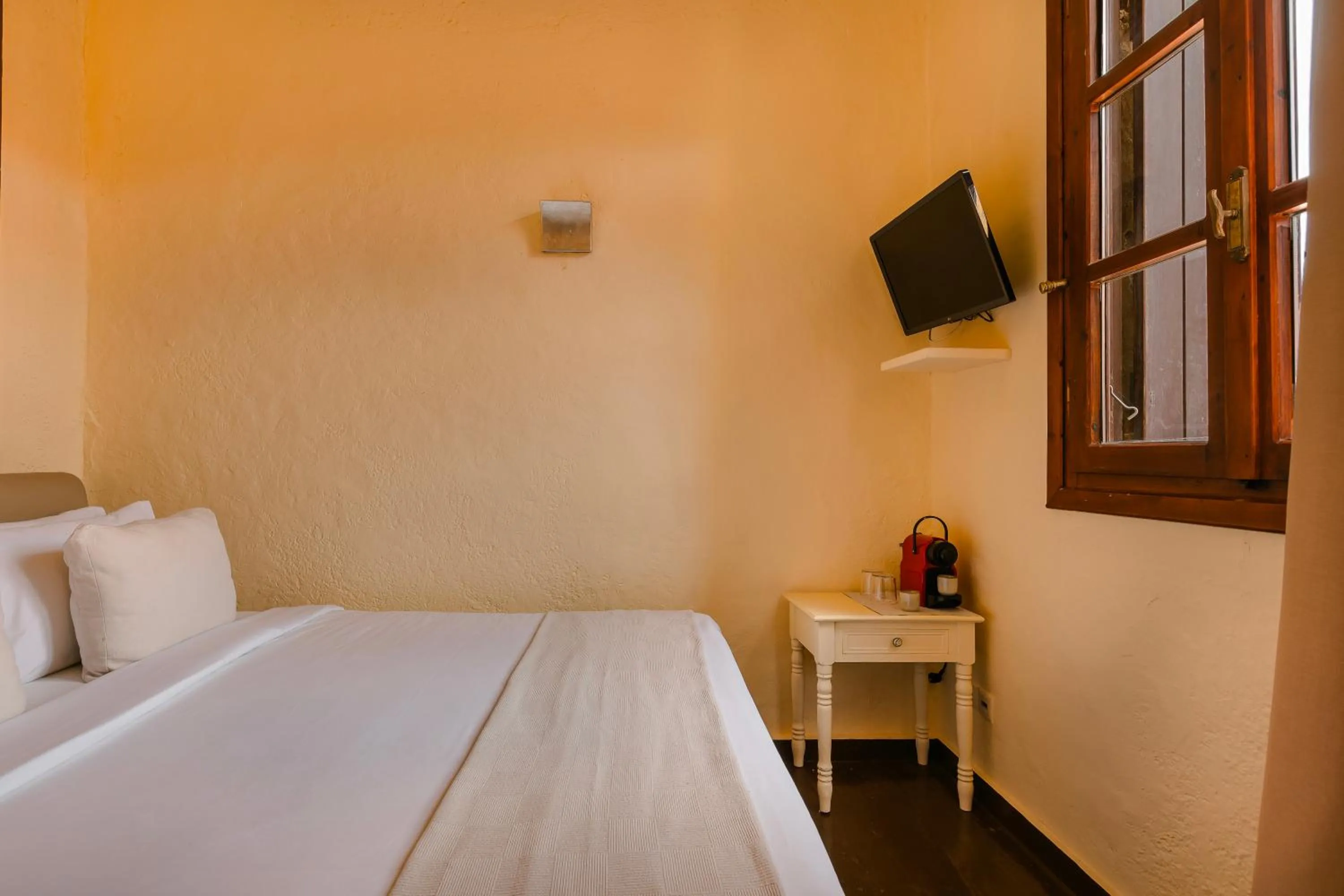 Bed in Alcanea Boutique Hotel