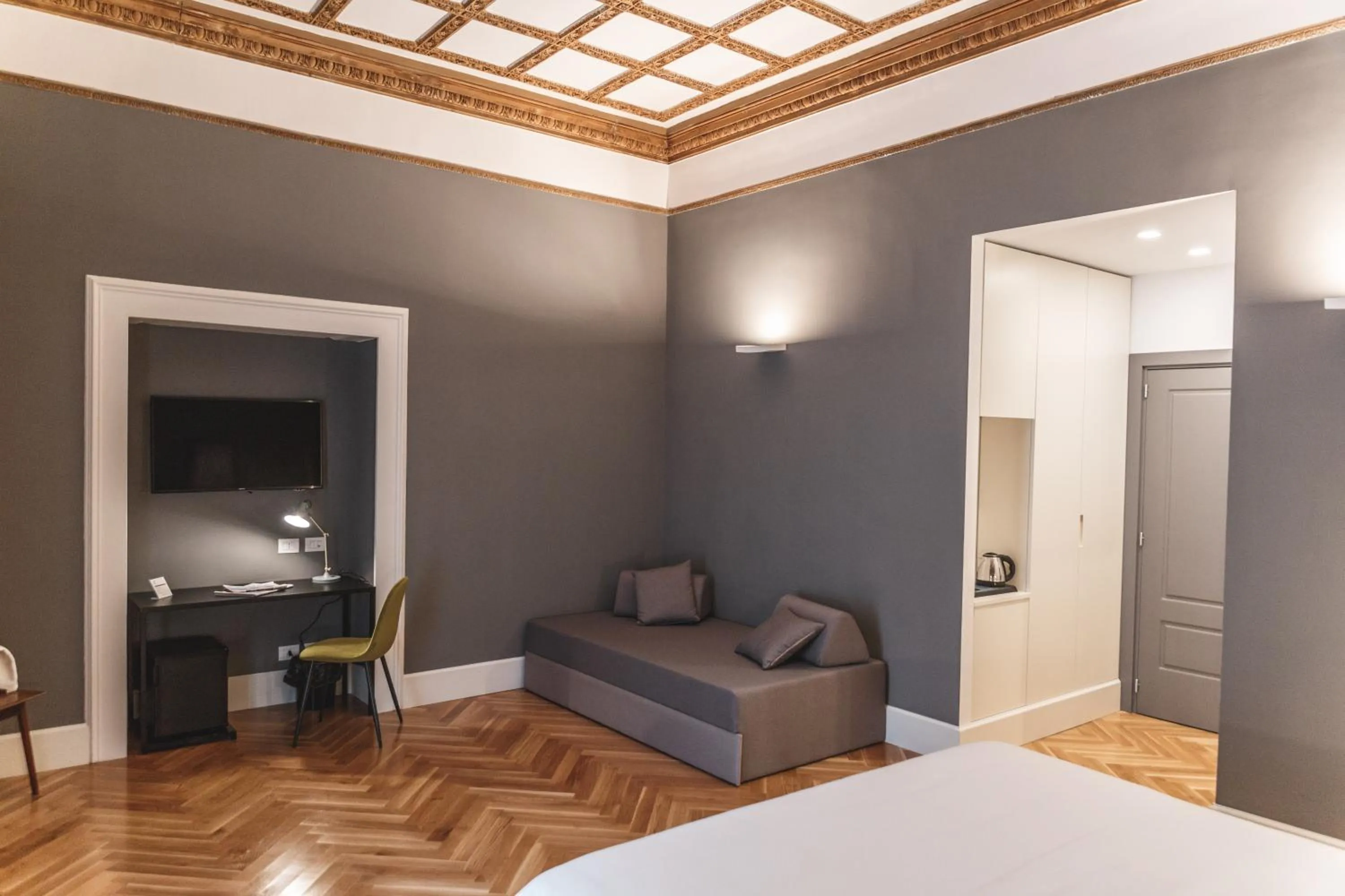 Seating area, Bed in Relais Della Porta