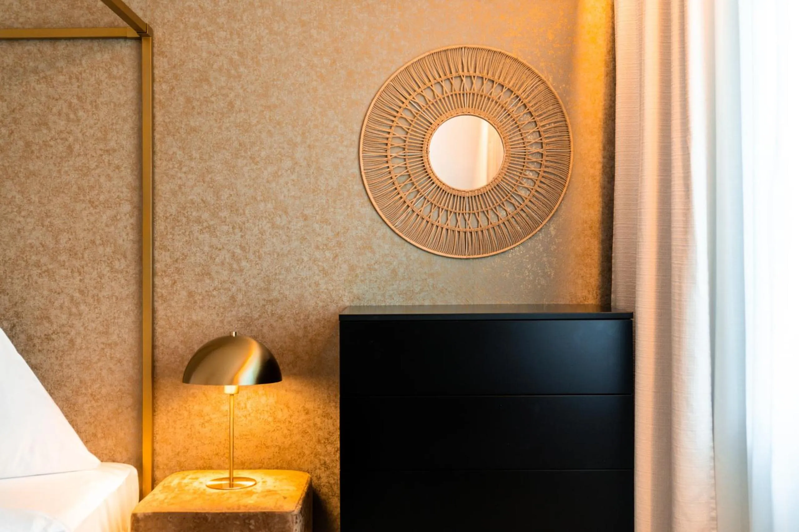 Bedroom in goldfinger + suites