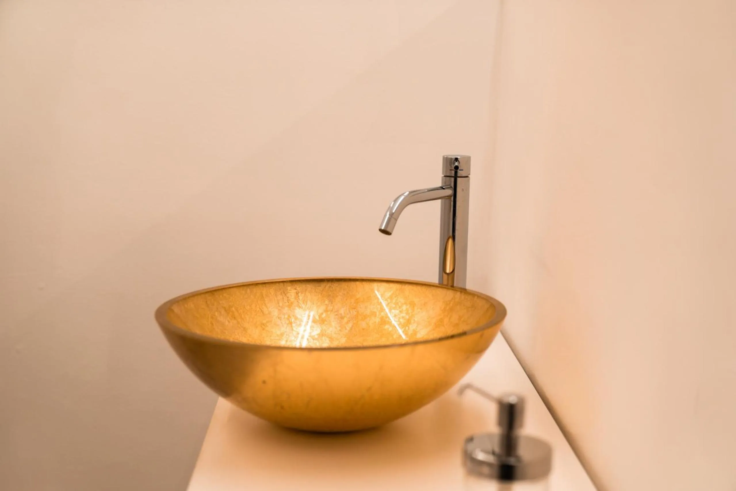 Bathroom in goldfinger + suites