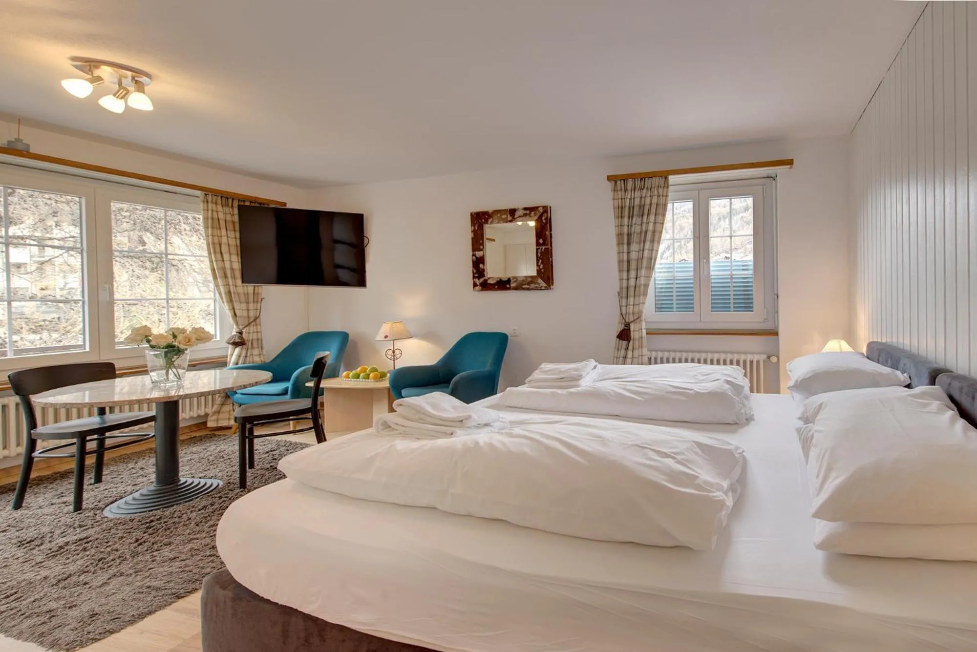 Living room, Bed in Good Value Apartments by MX Zermatt