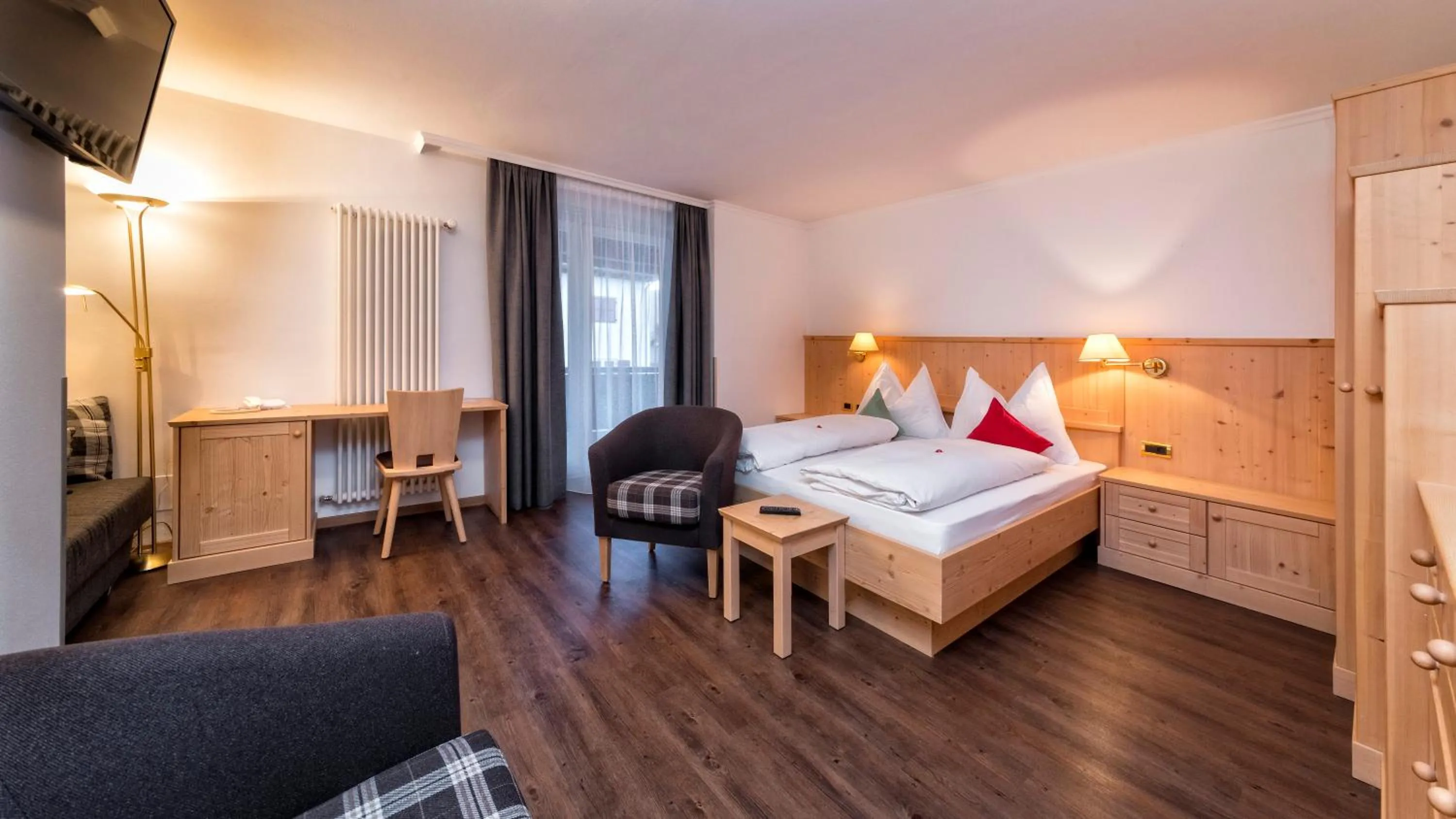 Photo of the whole room, Bed in Geniesserhotel Messnerwirt Olang