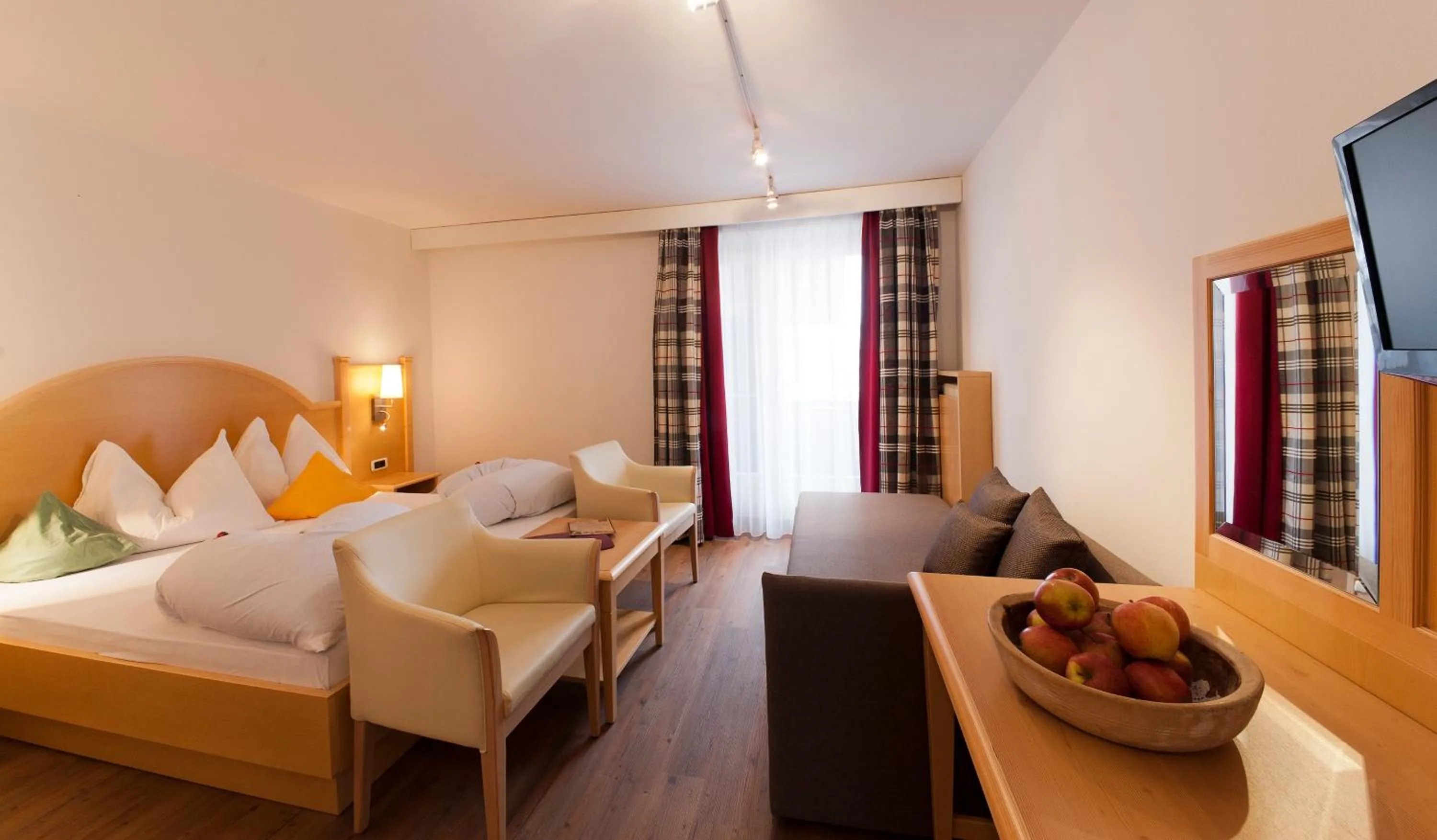 Photo of the whole room, Bed in Geniesserhotel Messnerwirt Olang