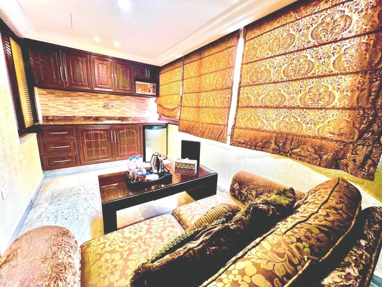 Kitchen or kitchenette in Queens Suite Hotel