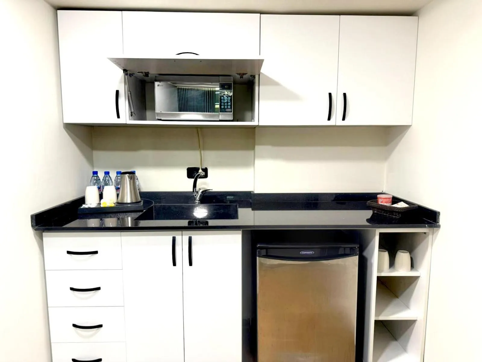 Kitchen or kitchenette in Queens Suite Hotel