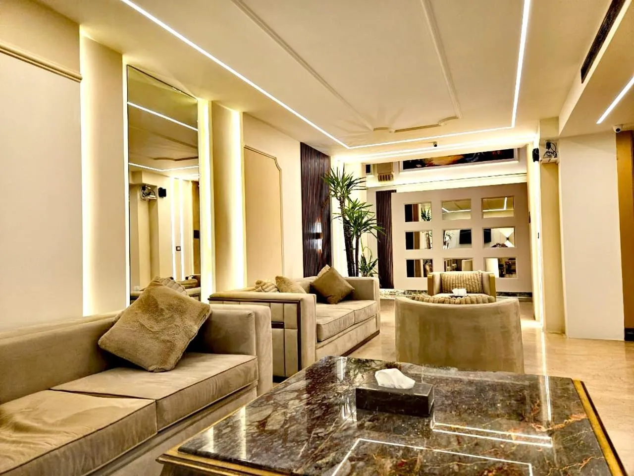 Lobby or reception in Queens Suite Hotel