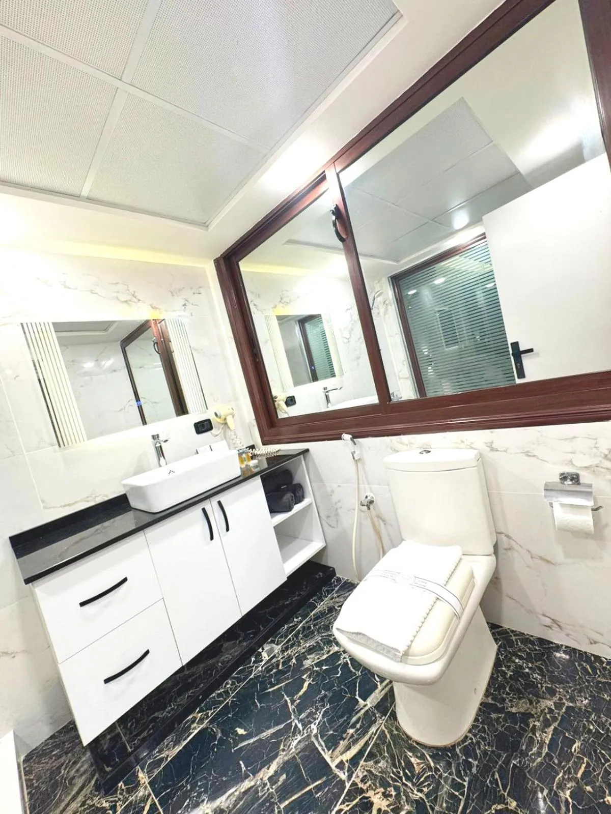 Bathroom in Queens Suite Hotel