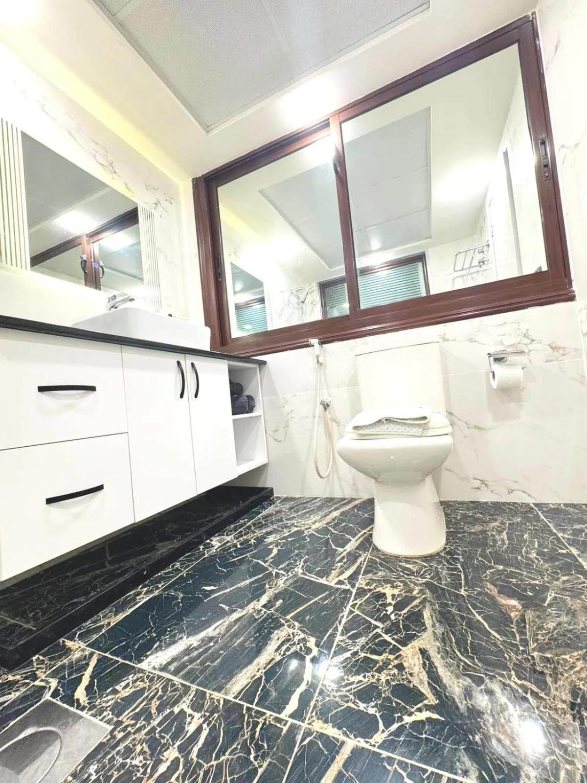 Bathroom in Queens Suite Hotel