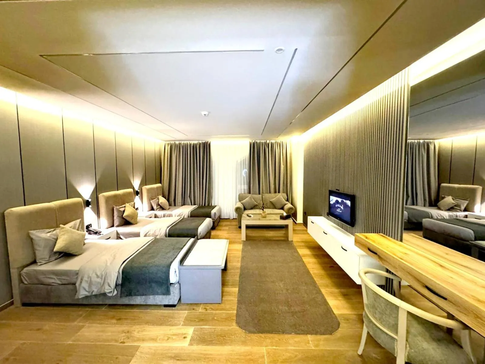 Bed in Queens Suite Hotel