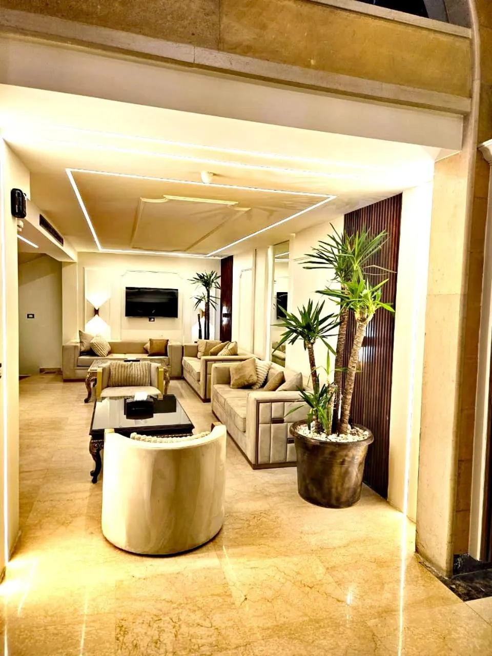 Lobby or reception in Queens Suite Hotel