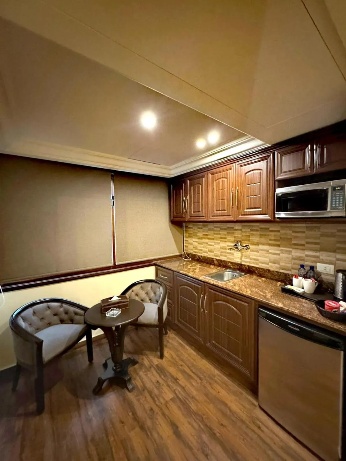 Kitchen or kitchenette in Queens Suite Hotel