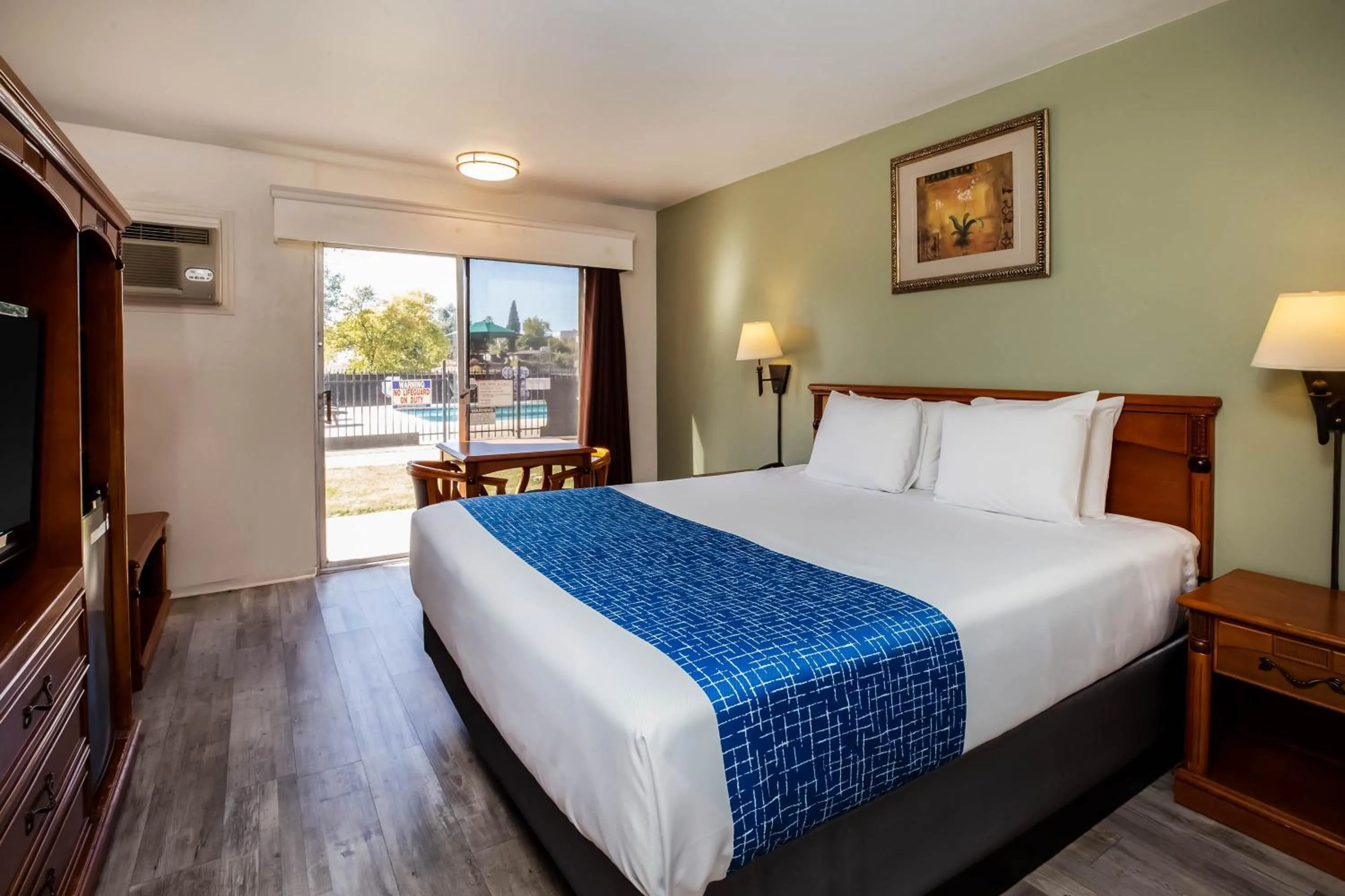 Pool view, Bed in Travelodge by Wyndham Red Bluff South of Redding