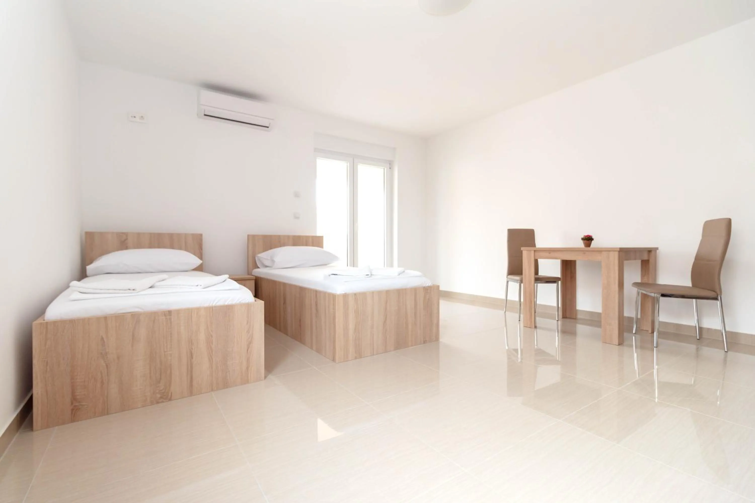 Bed in Summer Fun Apartments