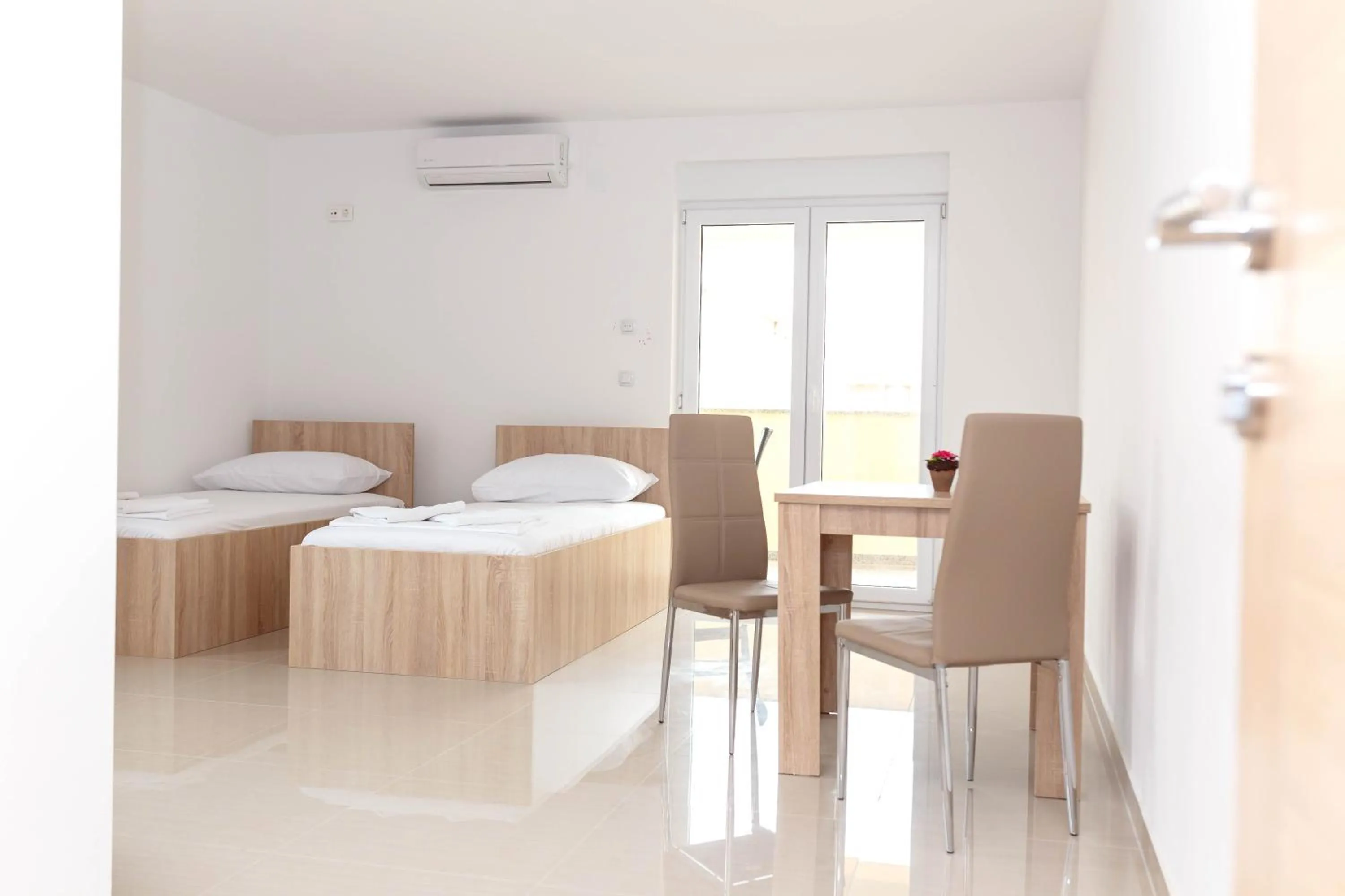 Bed in Summer Fun Apartments