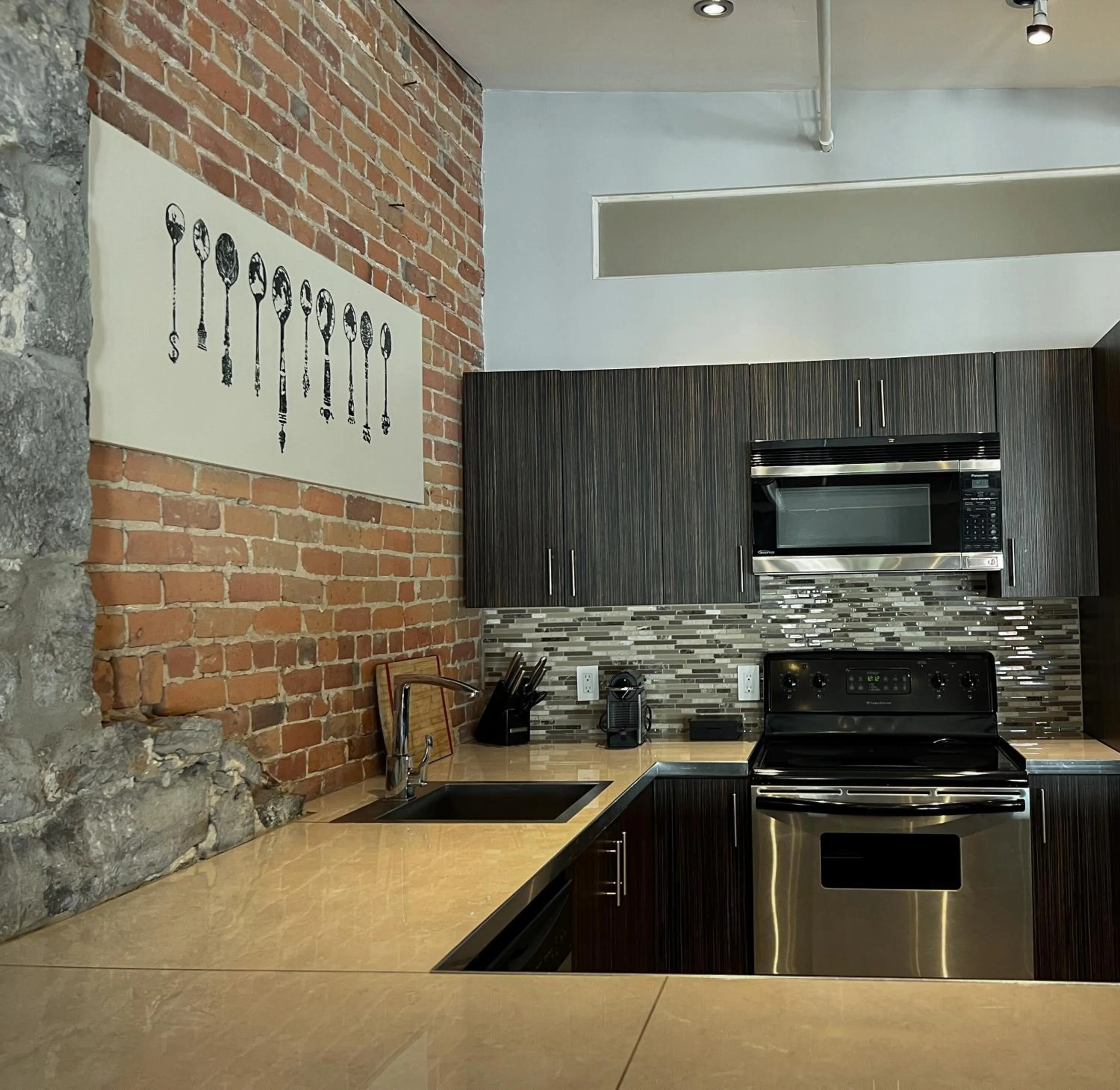 Kitchen or kitchenette in Lofts du Vieux-Port by Gray Collection