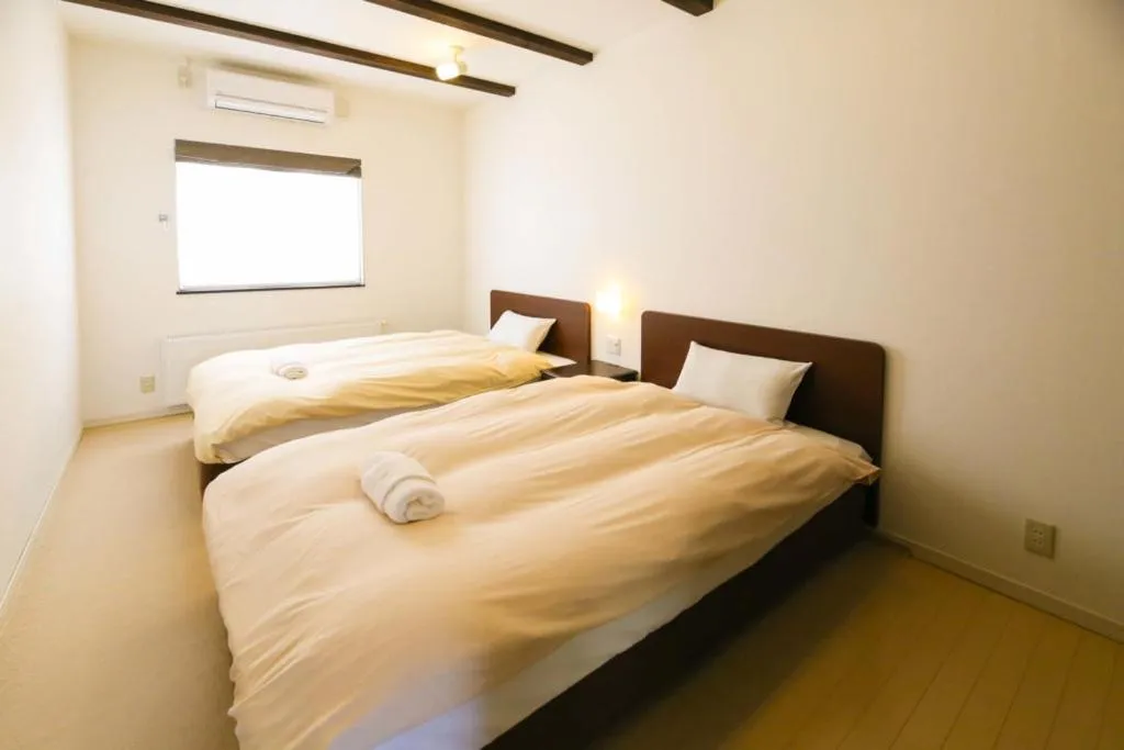 Bed in Tsuru Apartments