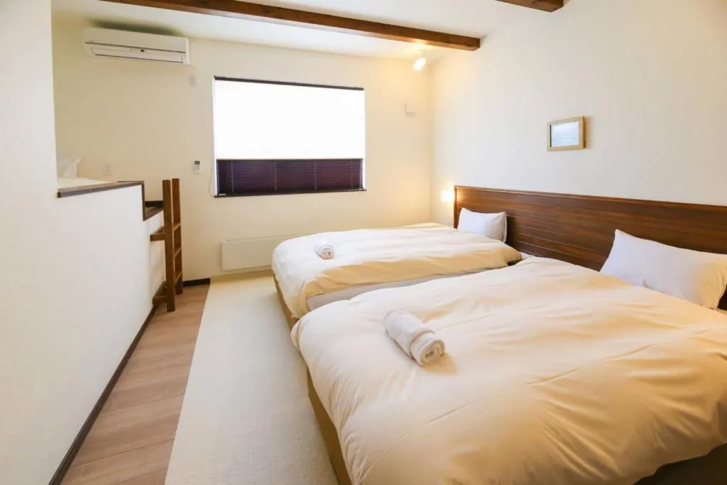 Bed in Tsuru Apartments