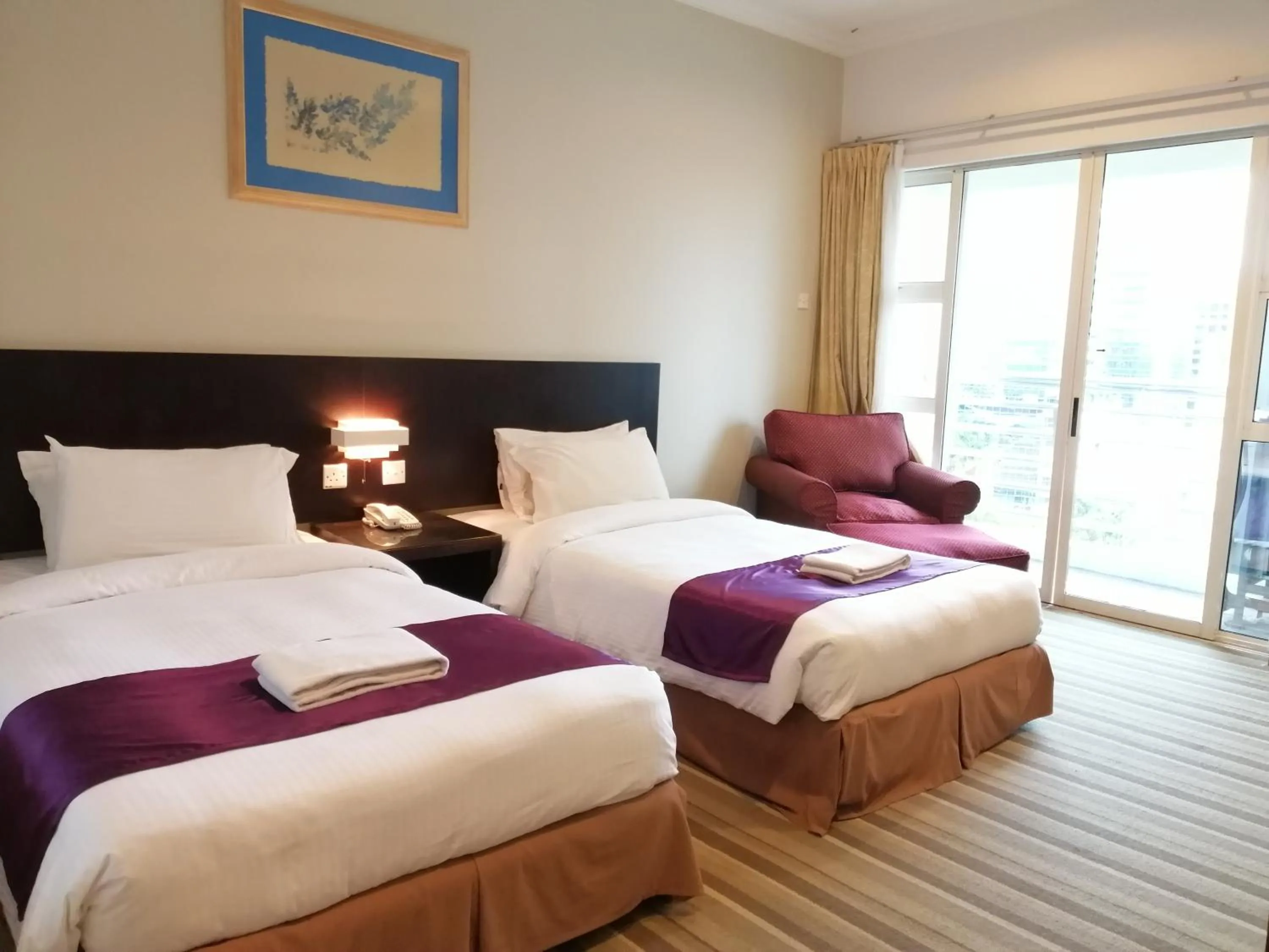 Bed in StayInn Gateway Hotel Apartment