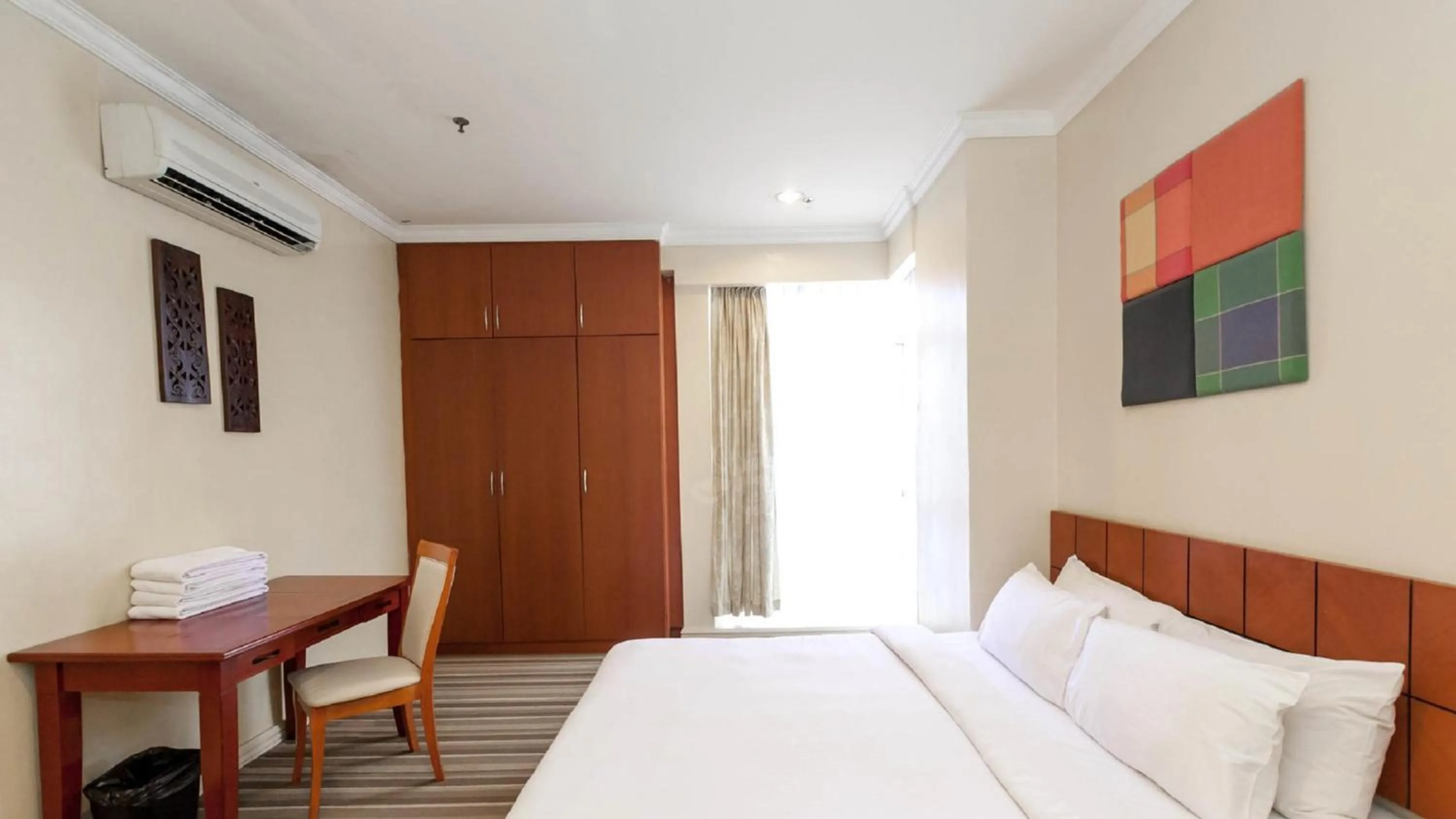 Bed in StayInn Gateway Hotel Apartment