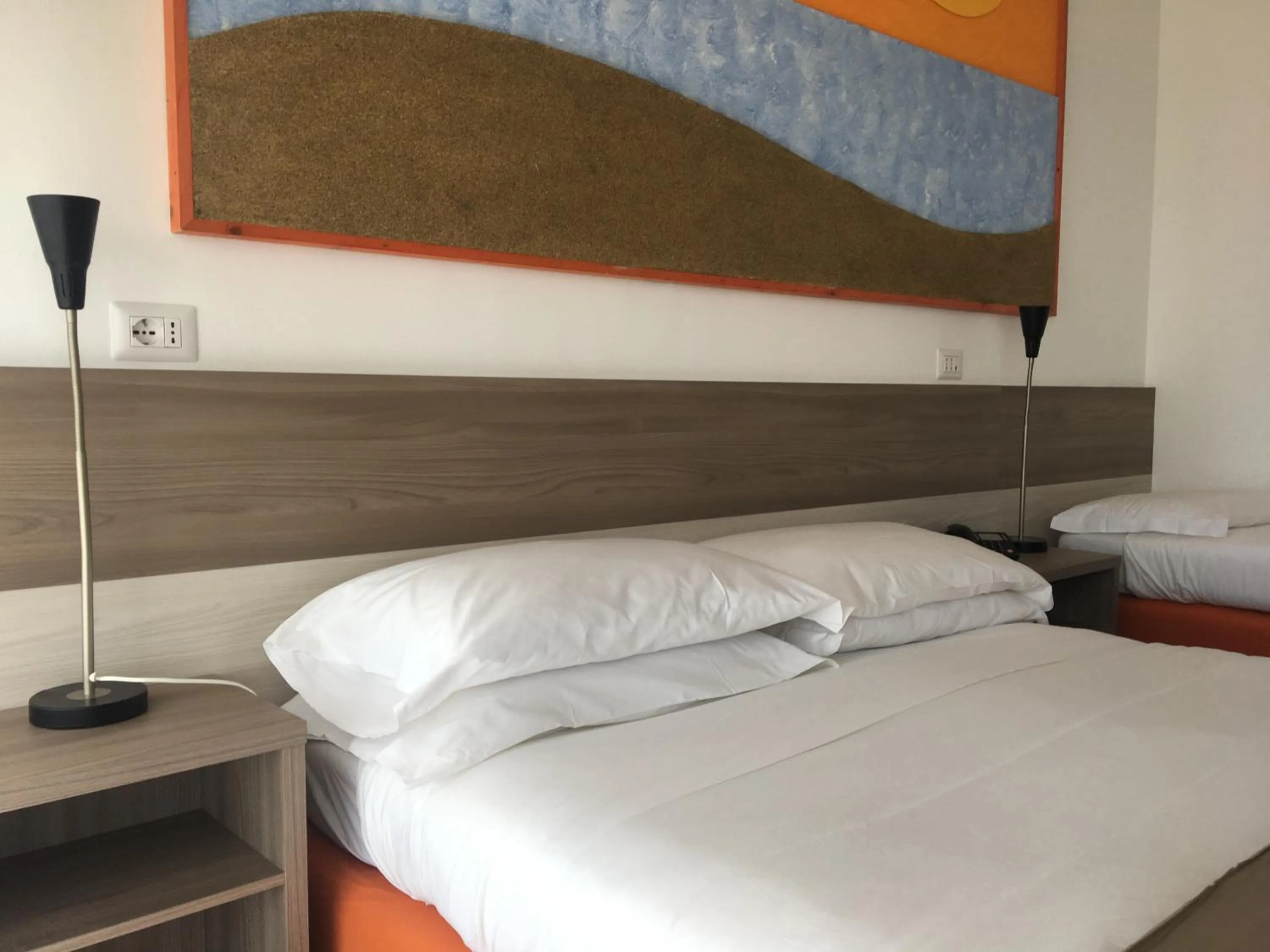 Bed in Hotel Corallo