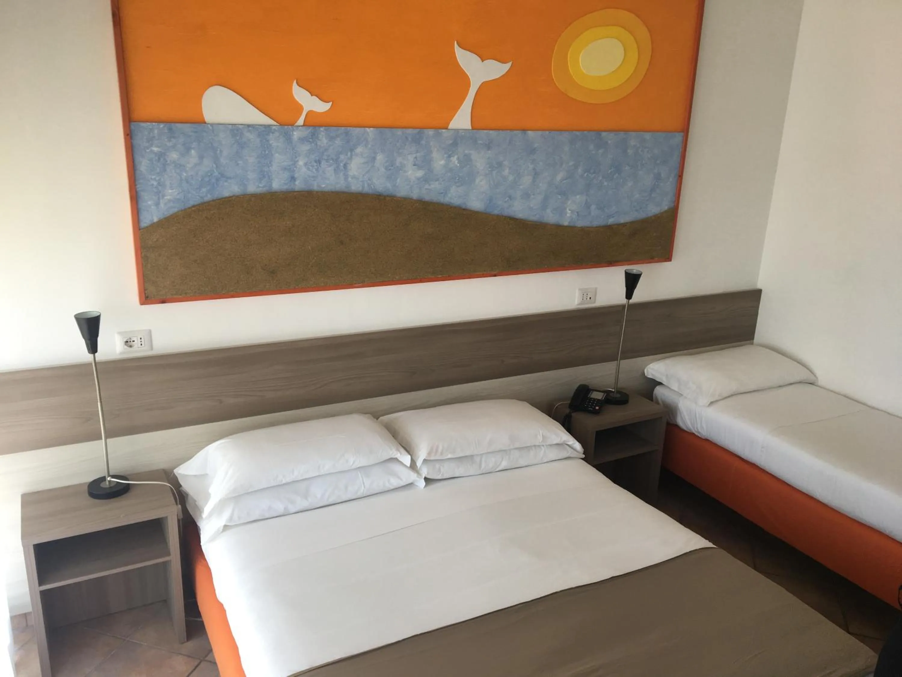 Bed in Hotel Corallo