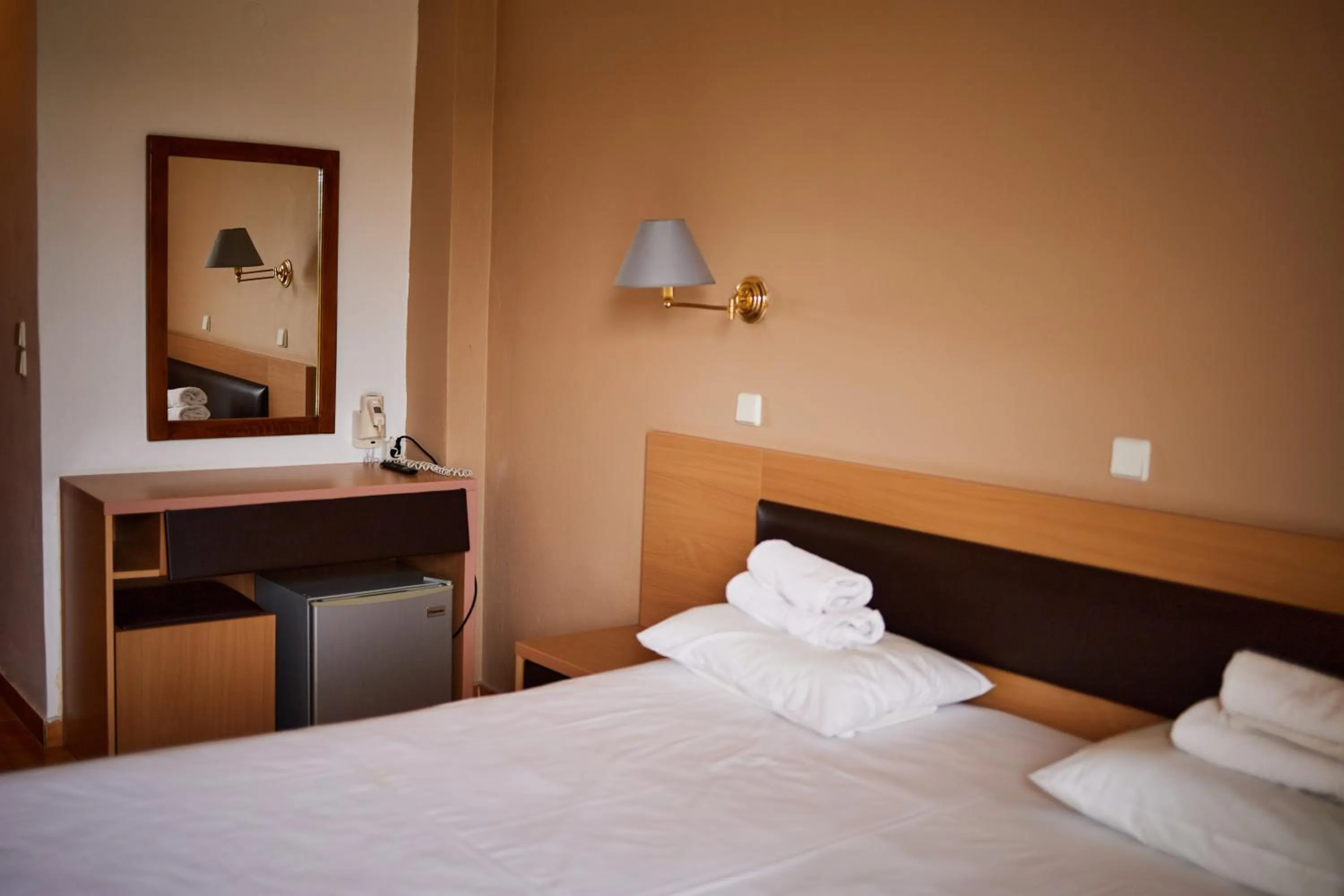 Bed in Rhodian Sun Hotel