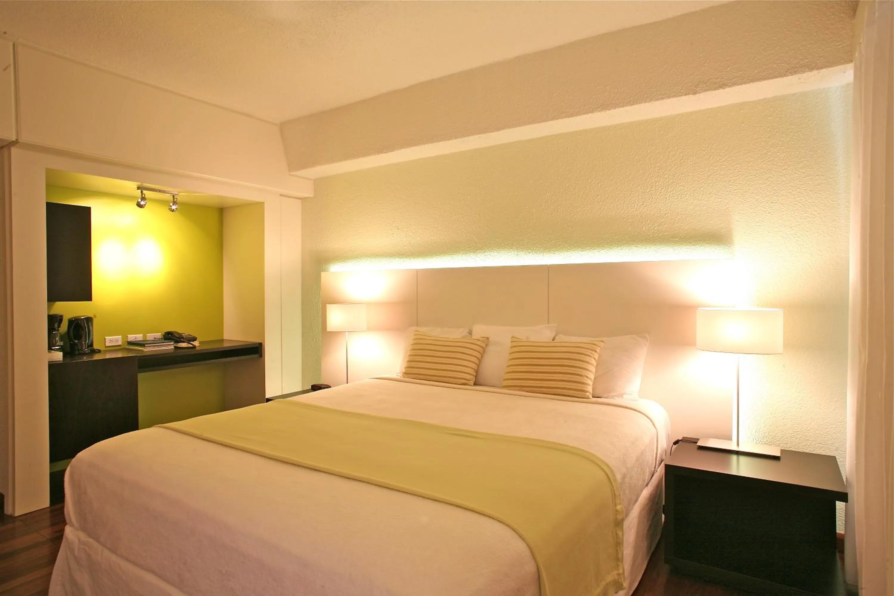 Bed in Holland House Beach Hotel