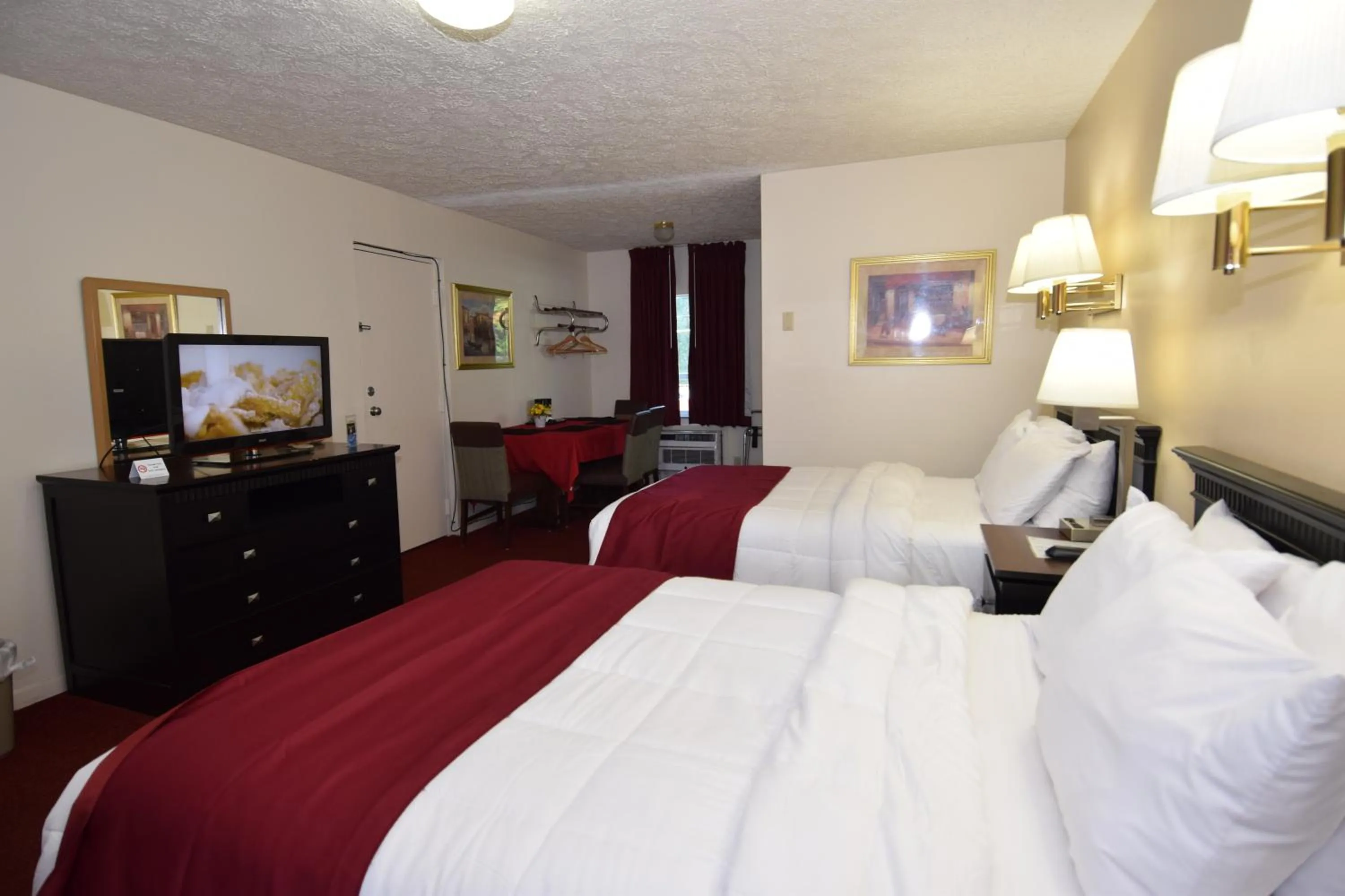 Bed in Knights Inn Oswego East