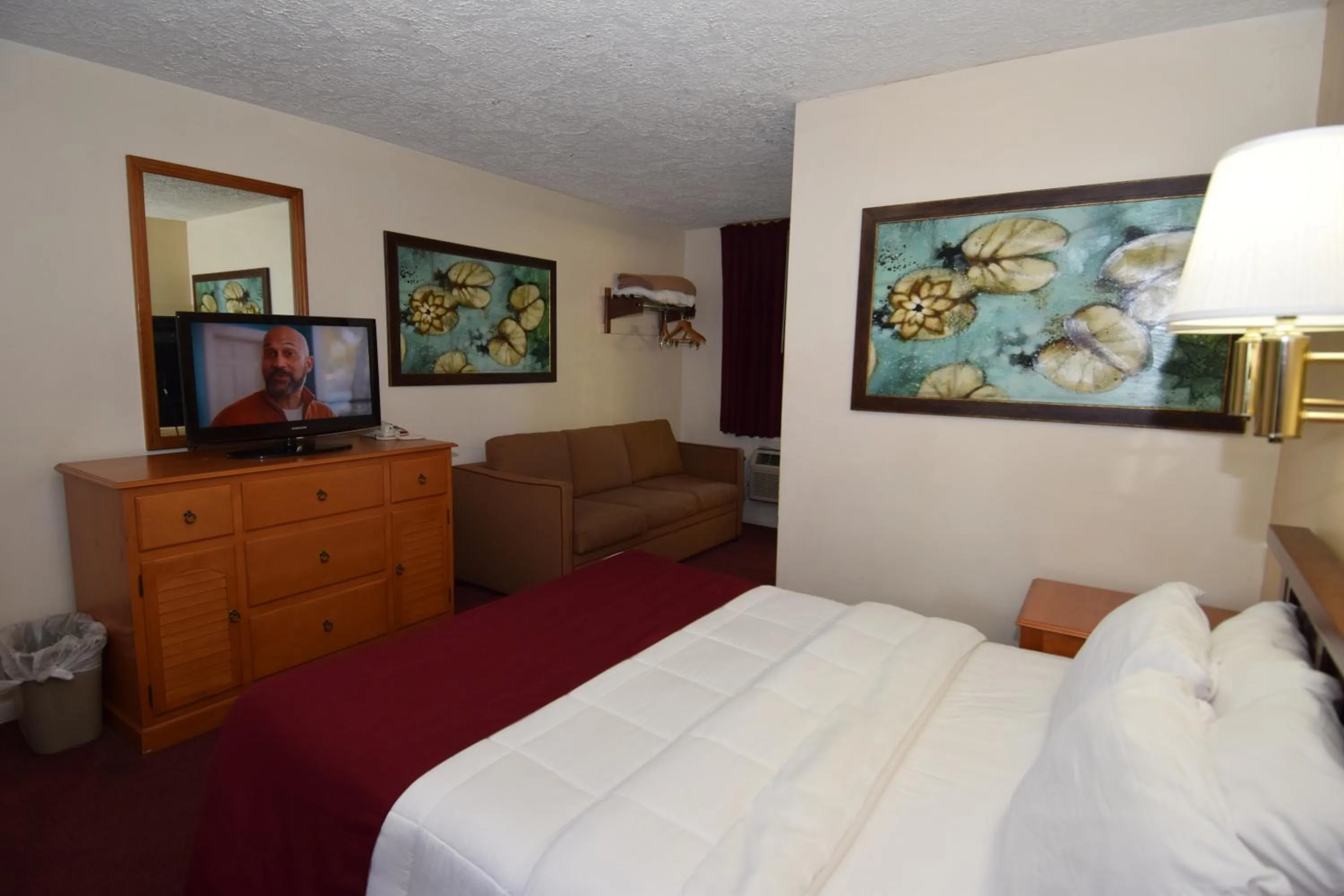 Bed in Knights Inn Oswego East