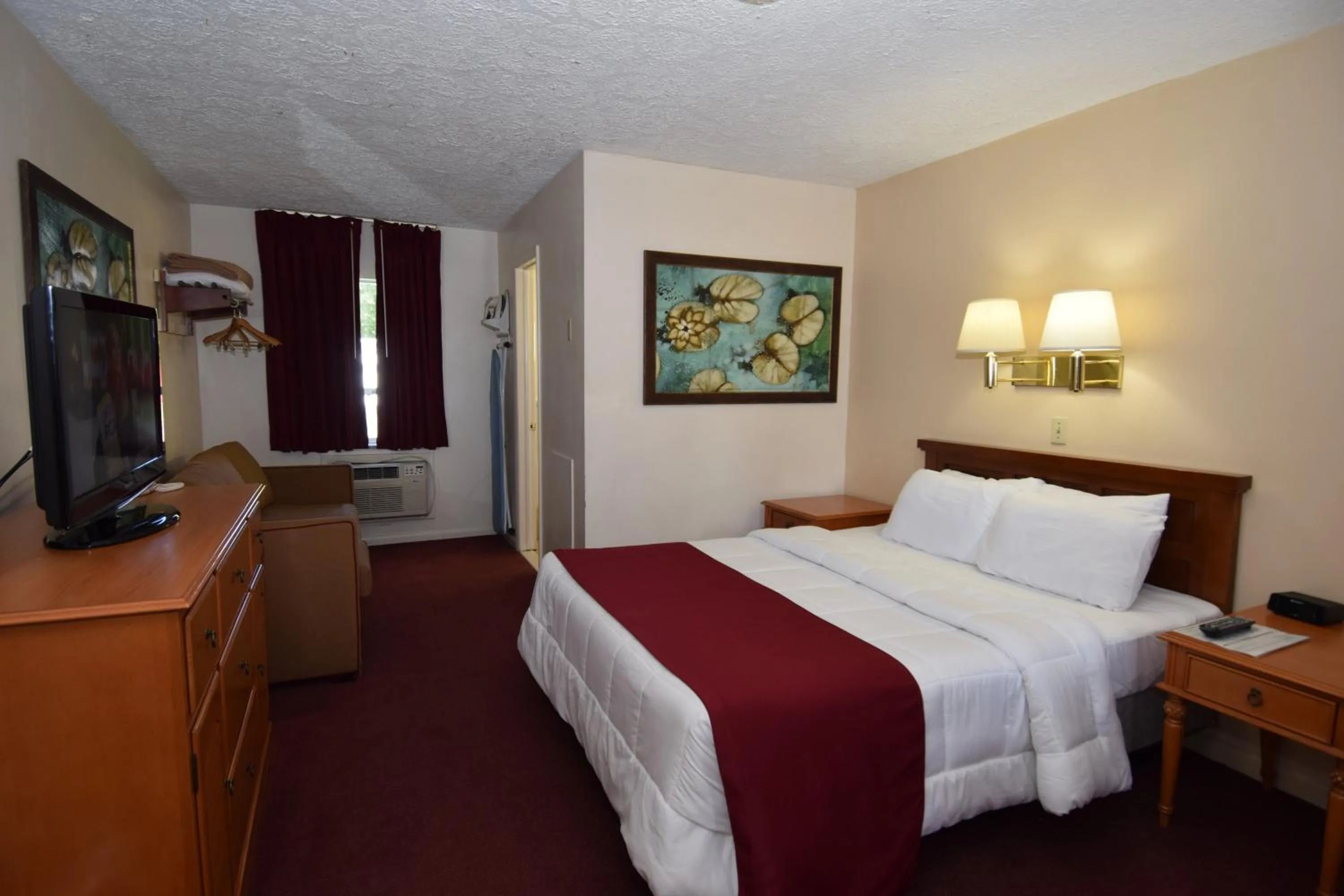 Bed in Knights Inn Oswego East